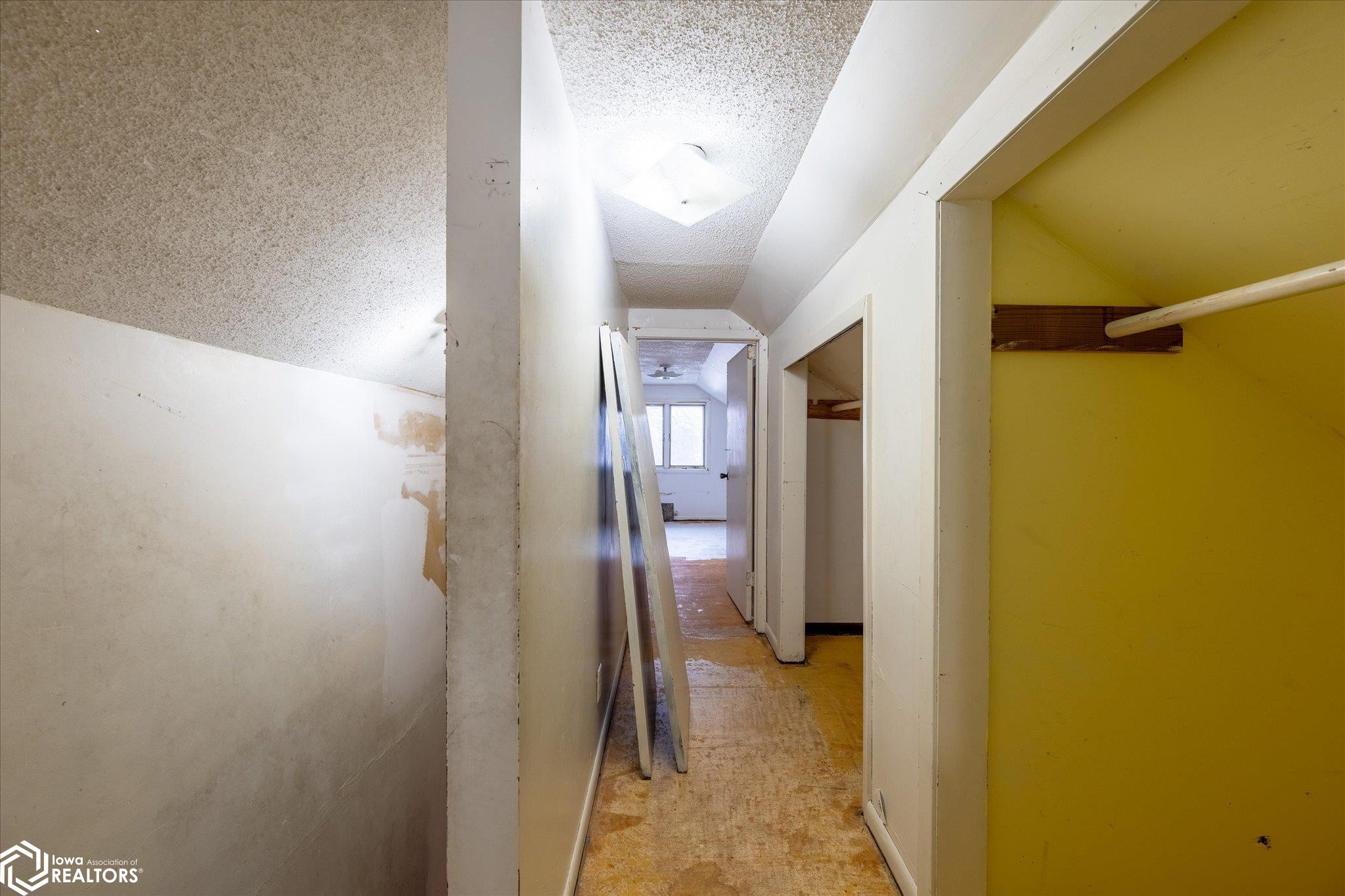 Looking North into the upstairs hallway from the South bedroom.