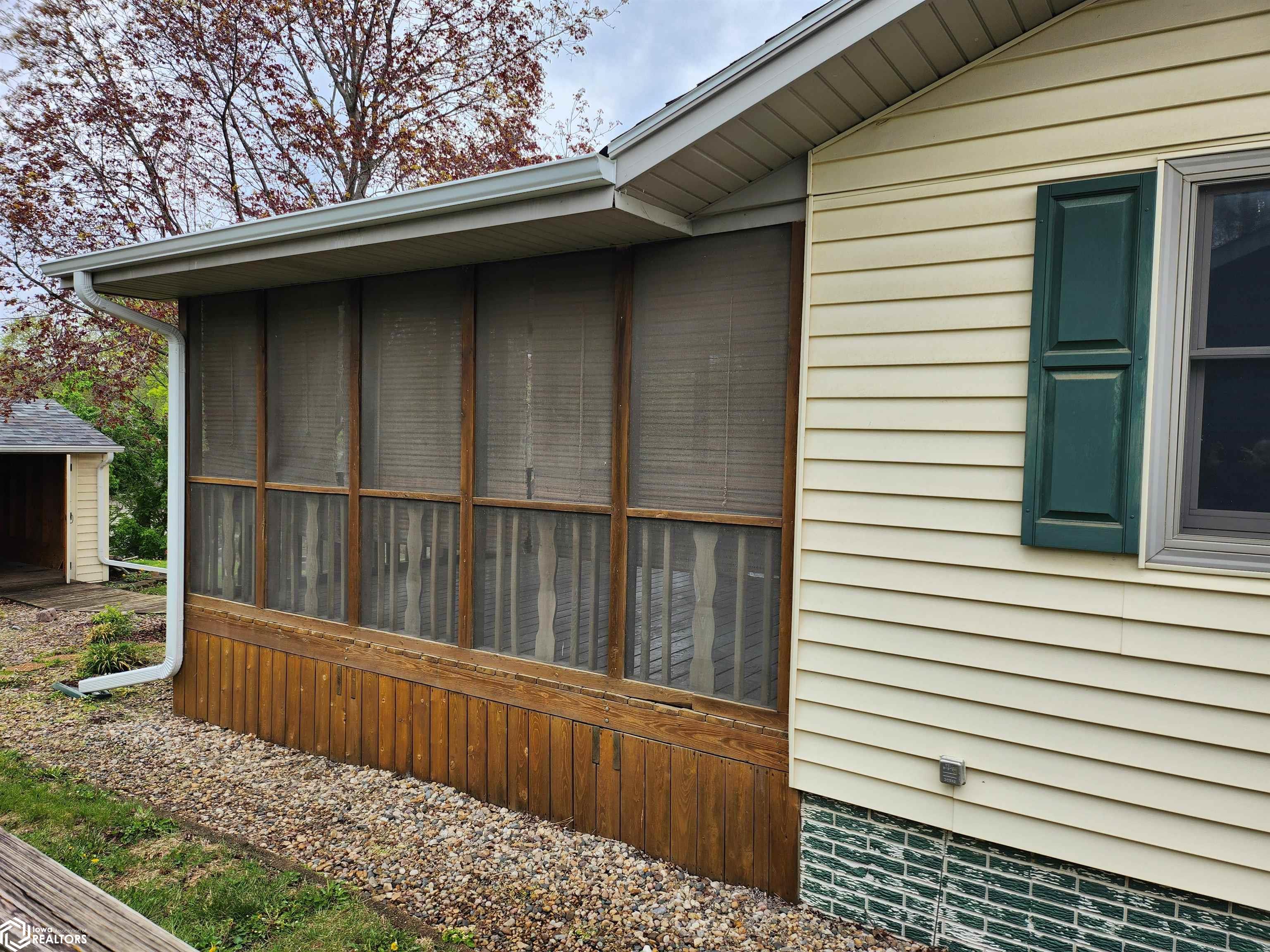Screen deck with stairway down to the rear yard (on other side of the room)
