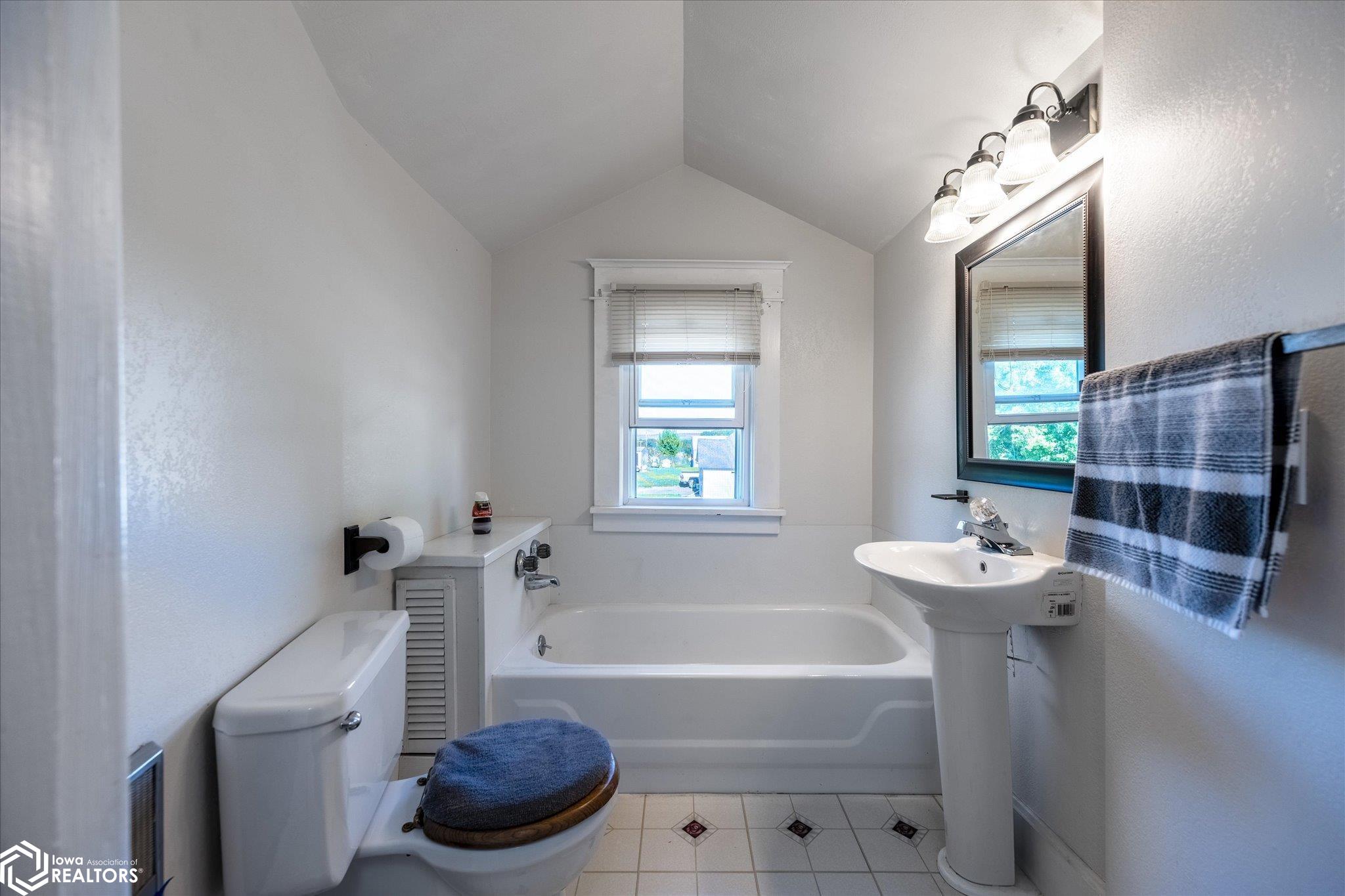 Looking East into the upstairs bathroom.