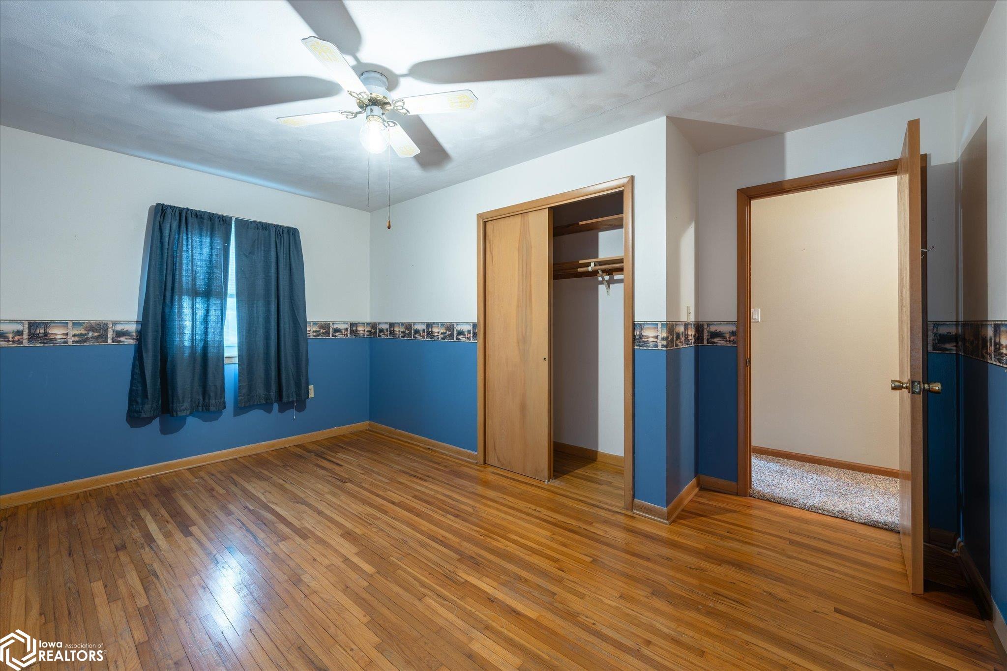 Natural hardwood floor, double closet and ceiling fan