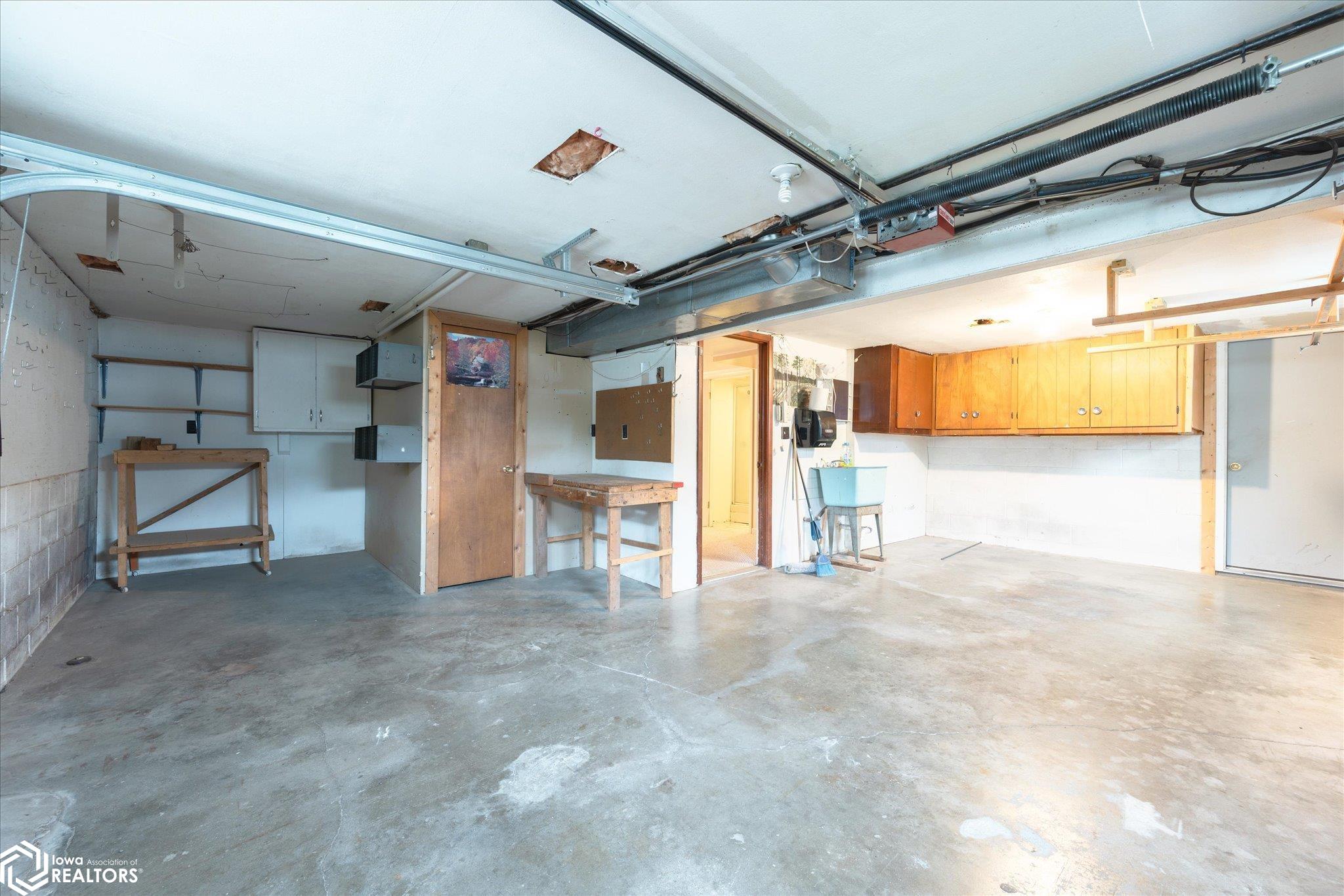 Exterior door to the insulated shop area, plus handy lower level 3/4 bath.