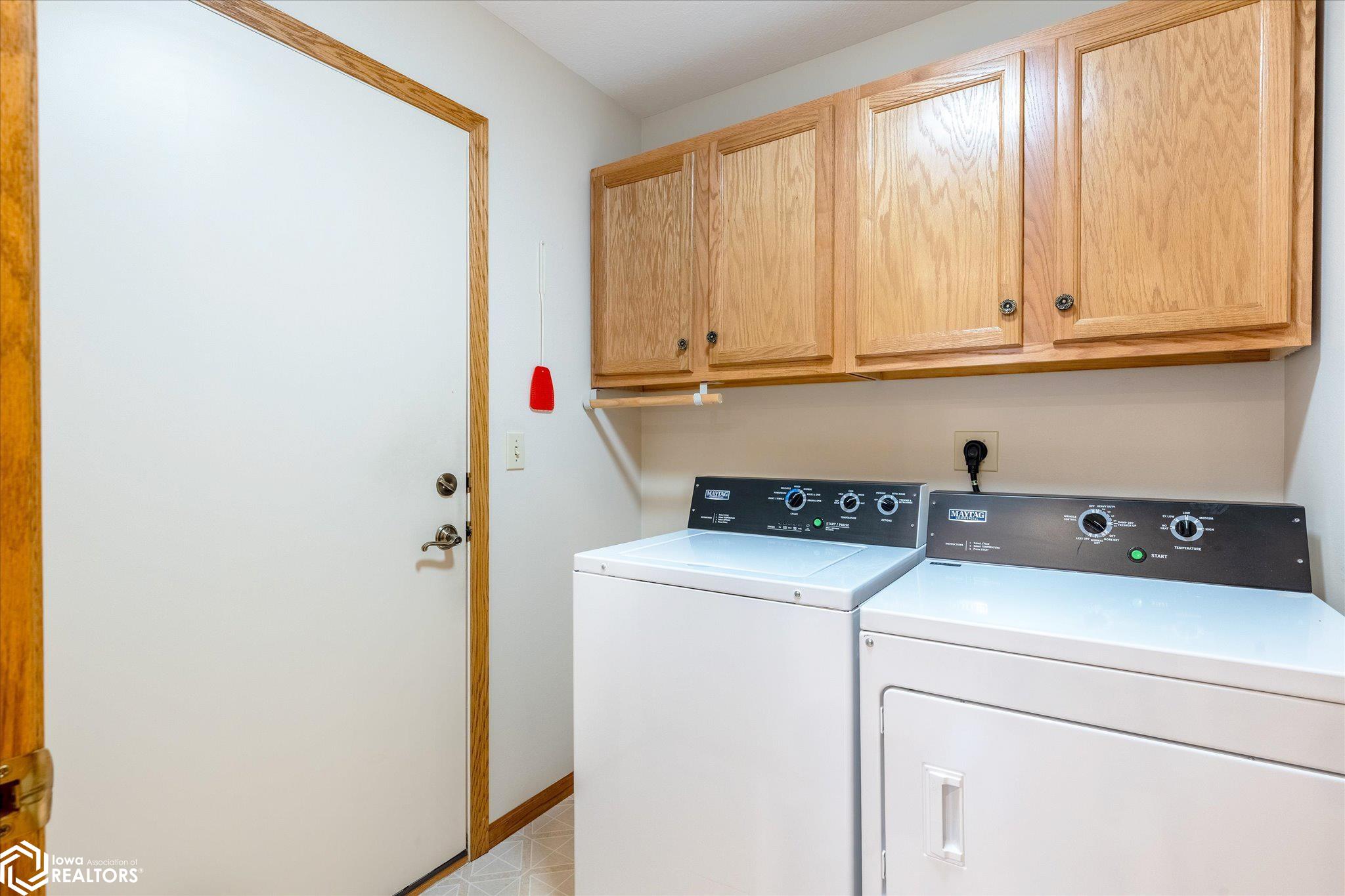 View looking towards the walk in door to the 2 car attached garage.  Washer/dryer included.