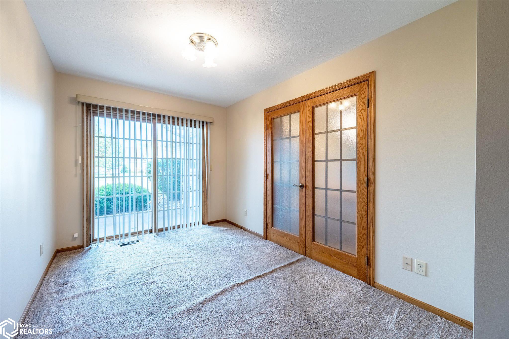 View from the primary bedroom looking E towards the door that leads to the patio.