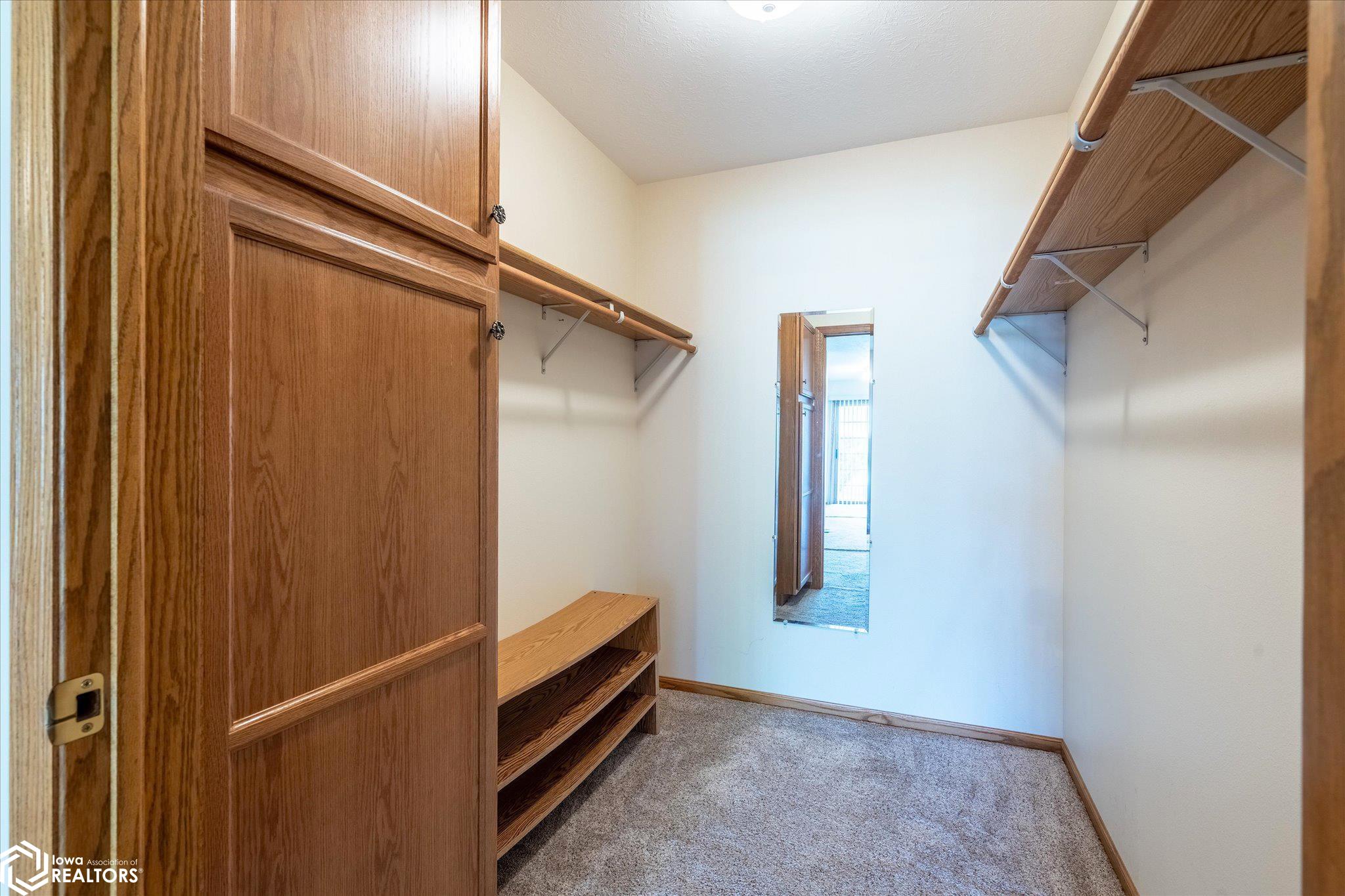 View of the primary walk in closet.