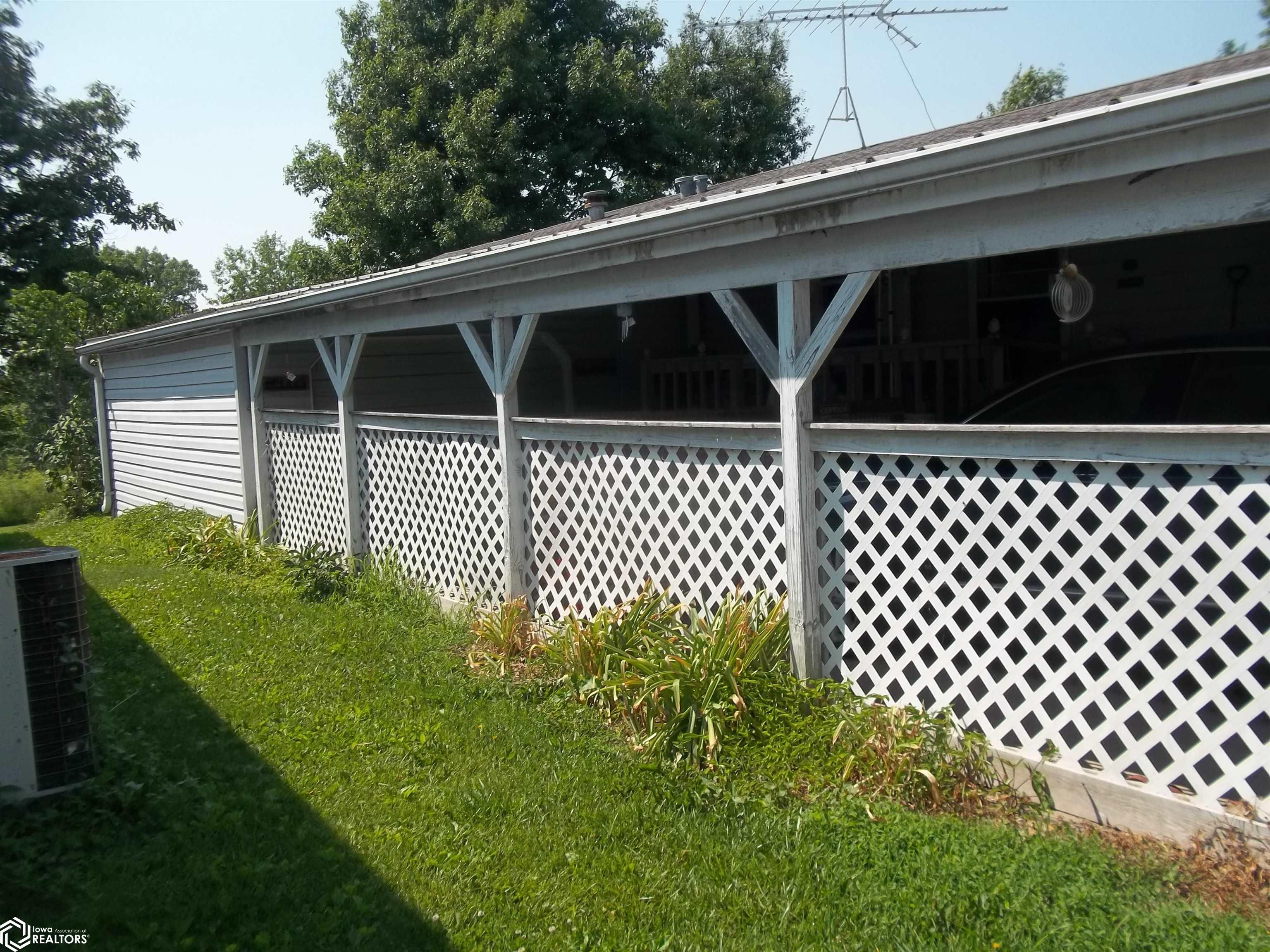 You can see the enclosed garage at end of carport.