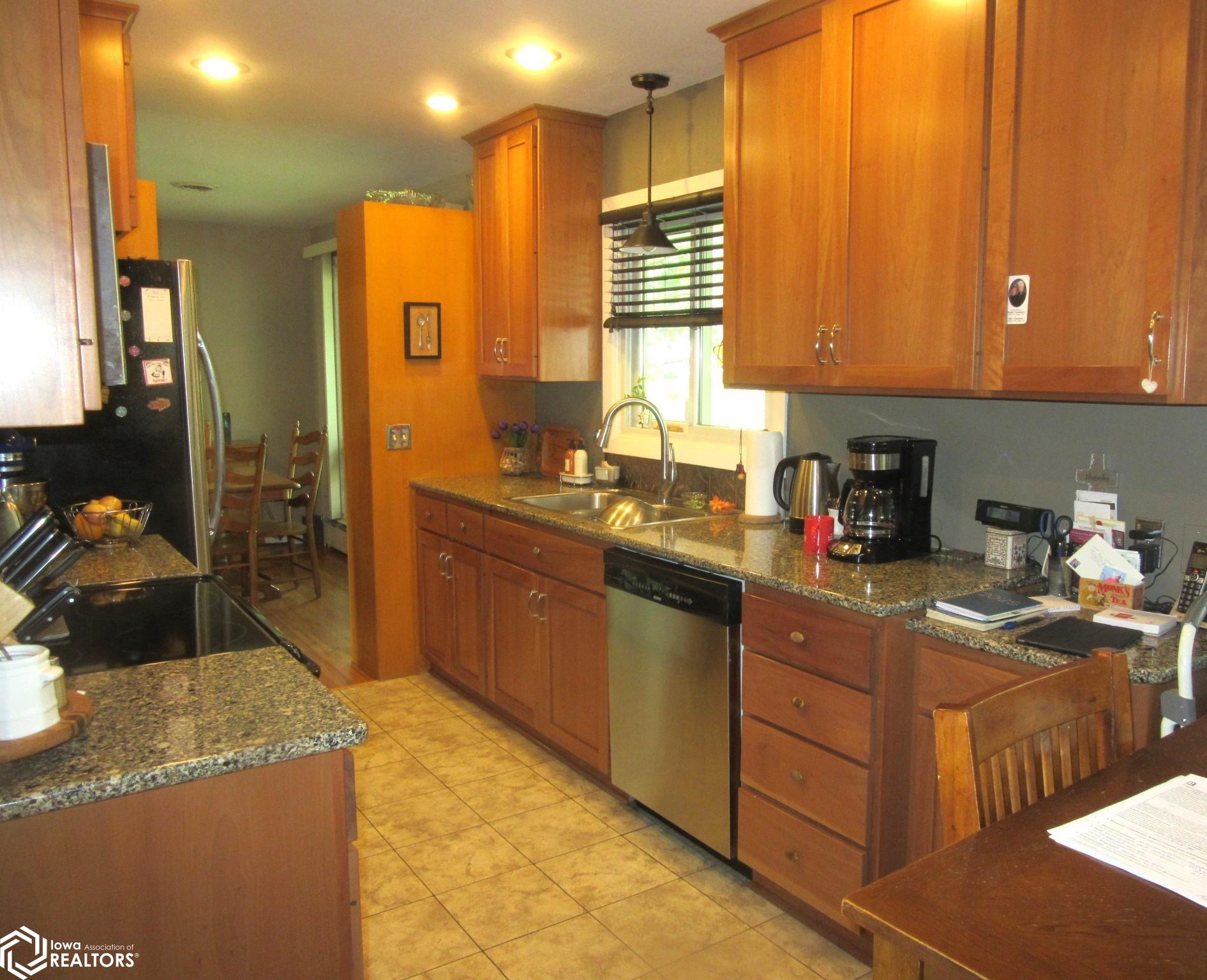 Updated Kitchen with custom cabinetry, ample work space and storage.