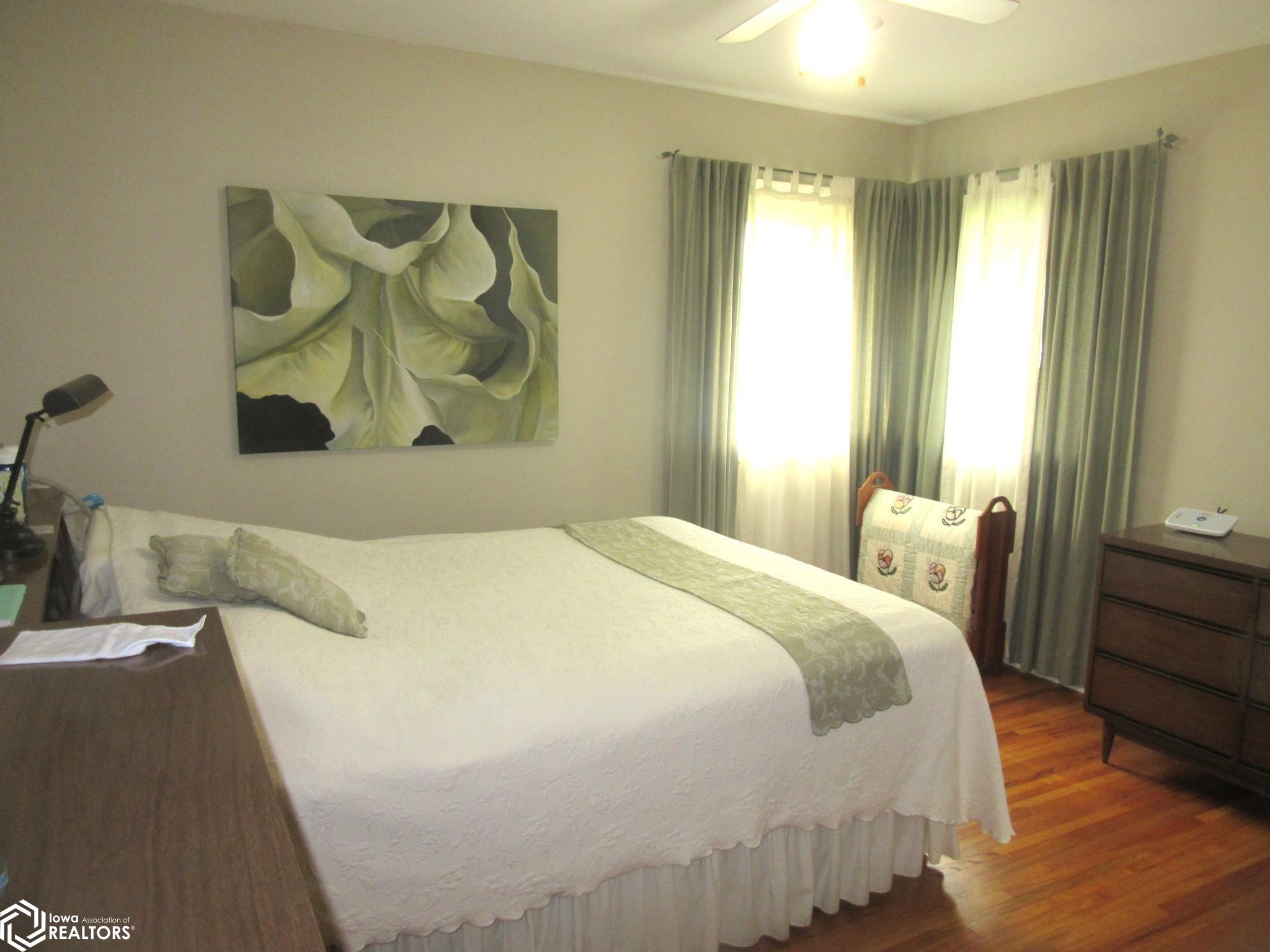 Master Bedroom with hardwood floors and good closet space.