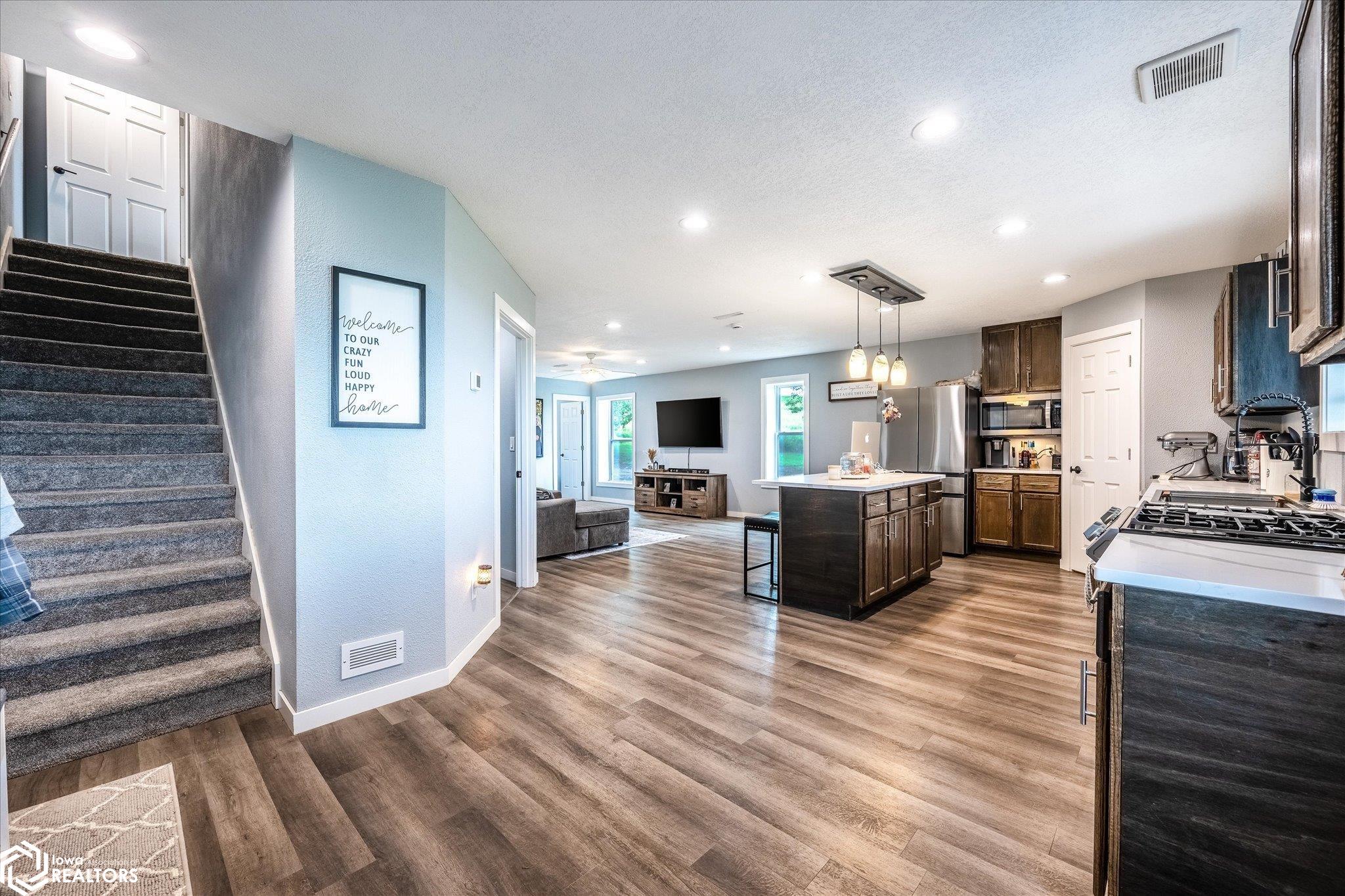 Looking at the kitchen and living room.
