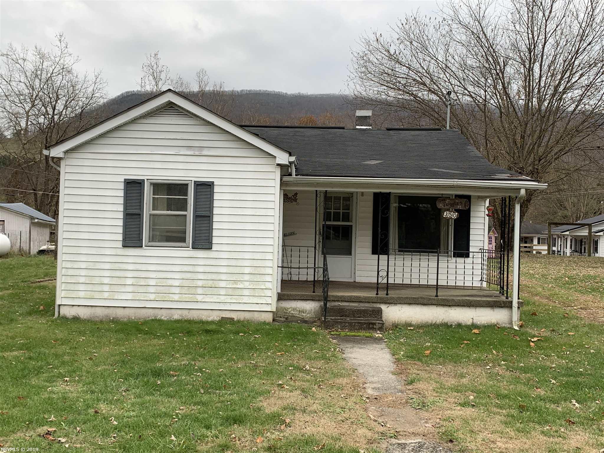 This 2 bed 1 bath home is located right in the middle of Rocky Gap. It is close to the gas station, post office and Bland Intermediate and High School. This house sits on a beautiful .5+/- acre lot. There is a detached carport with two sheds for storage.