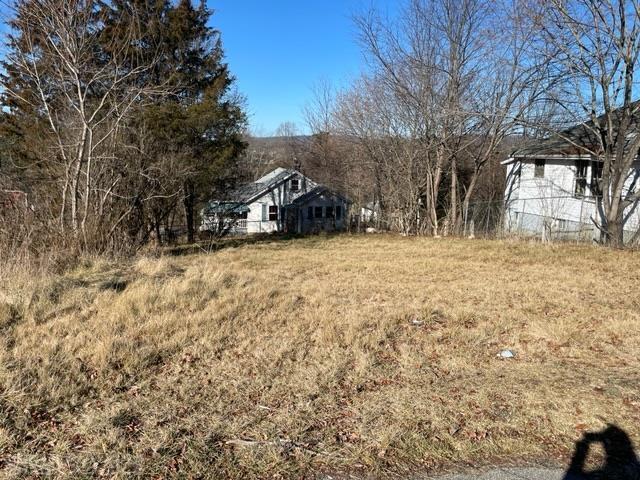 The old house has been removed and the lot graded ready to build on. Water and sewer are available at the street. Connection fees would apply. The lot acreage is estimated.  The buyer to verify.