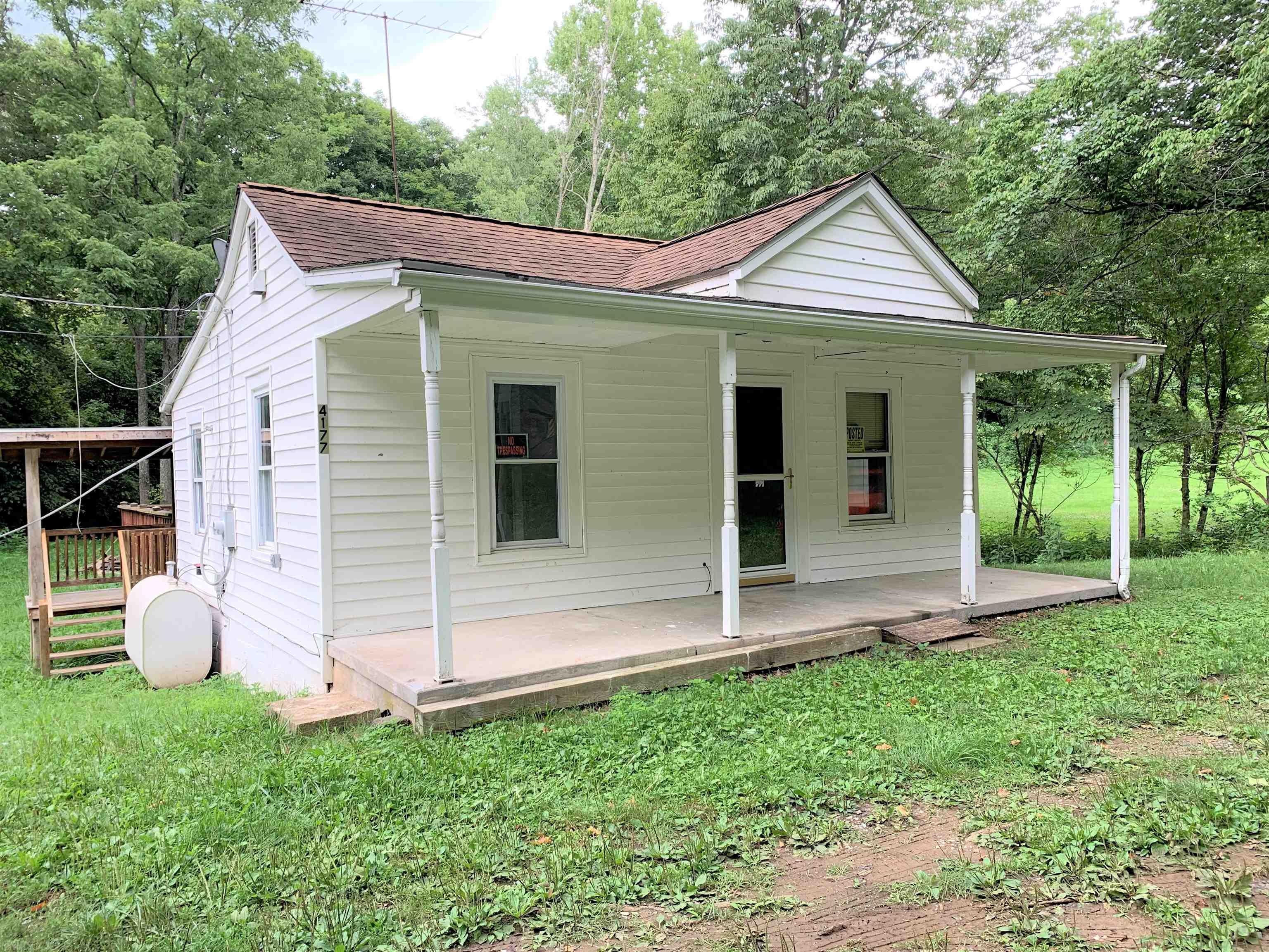 Great Get-a-way! Ranch on approx 0.57 acres Relax on the huge back deck with beautiful creek frontage. Level yard. Insulated windows. Well approx 5+/- yrs old. Roof & oil furnace approx 8+/- yrs old. Covered front & back porches. Large storage building
