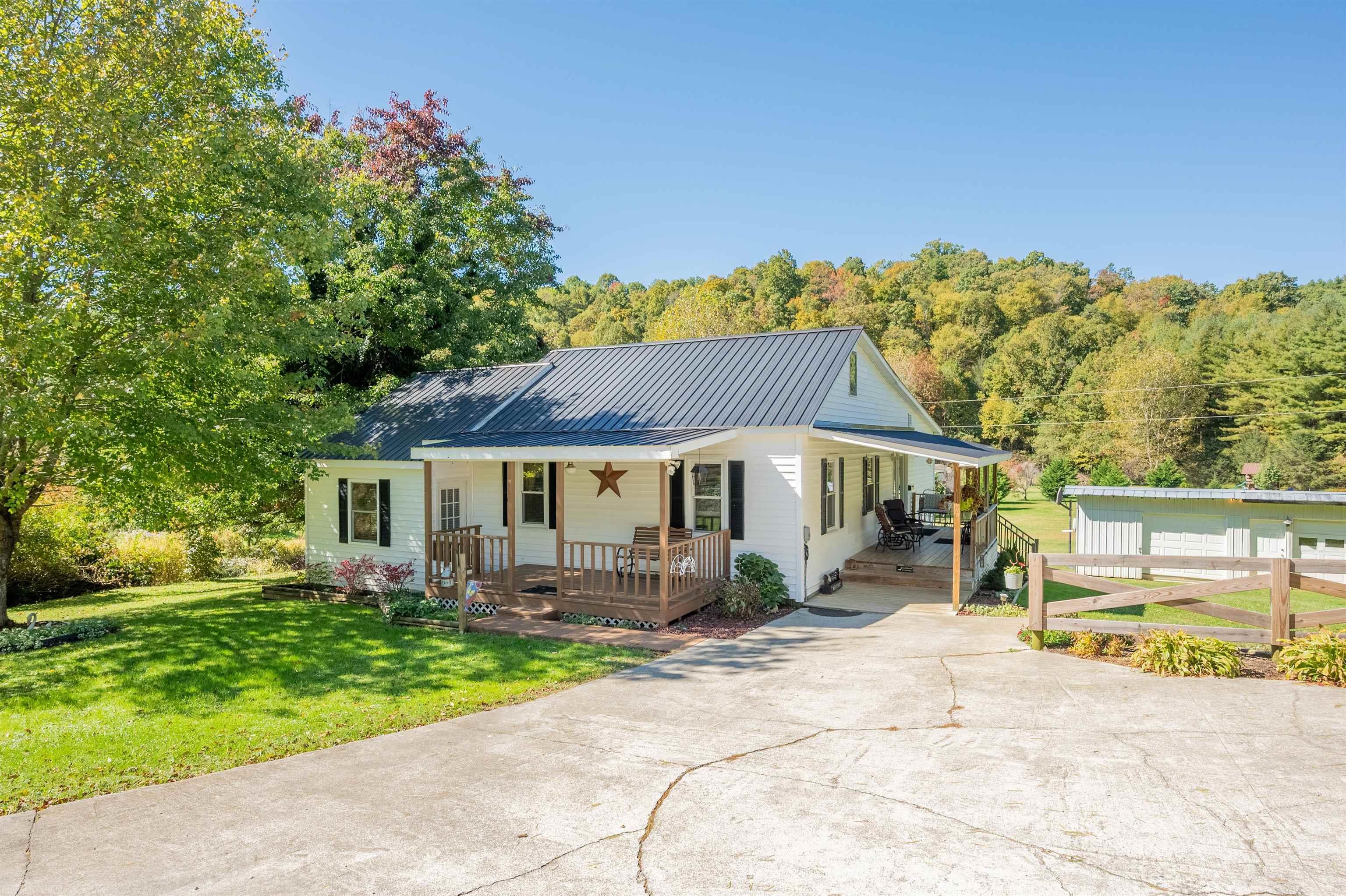 Charming country home in beautiful Floyd County.  This lovingly maintained home on 2+ acres is ready to be your mini farm.  Cozy with plenty of room for the family inside and out!  The 3 bay garage has room for a workshop and plenty of storage.  The large yard is open and flat with plenty of space for a large garden beside the creek. Finished attic space with a half bath!  Citizens Fiber Available! The County GIS map is incorrect, please see the Aerial map in documents for approximate property boundaries.  Sellers to have the property surveyed prior to closing.