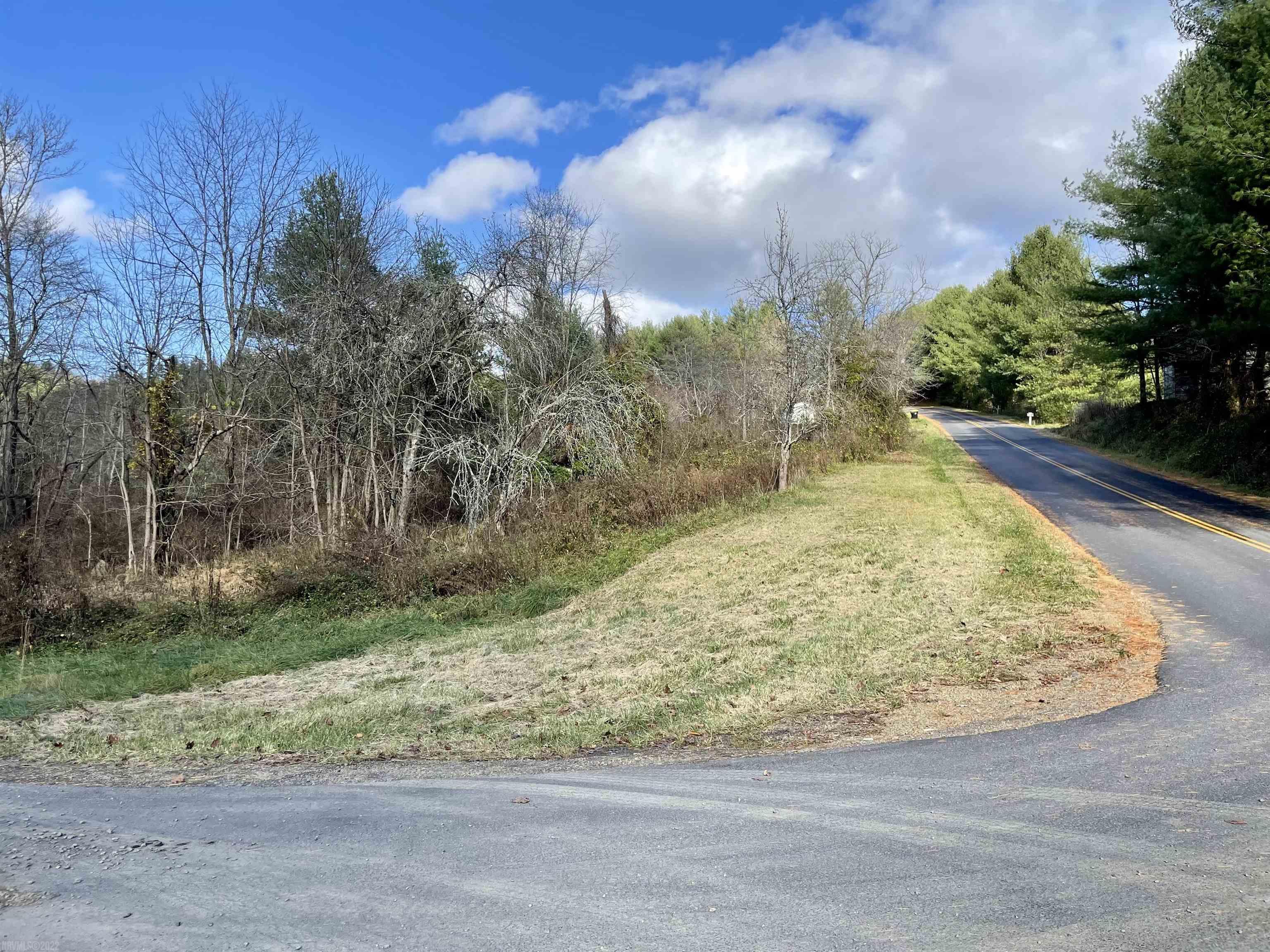 Looking for a site to build your forever home?  This lot, almost 3/4 of an acre, is located outside of Hillsville in Carroll County.  Conveniently located only 12 minutes from I-77 Poplar Camp exit 24 or 20 minutes from I-81 Pulaski/Hillsville exit 89.  The town of Hillsville---lots of dining, outdoor activities, schools, shopping, medical facilities, etc--is located a short 6 miles away.  This property borders Sugar Creek---you'll love hearing the  sound of the bold creek!  Public water is available for hook-up.