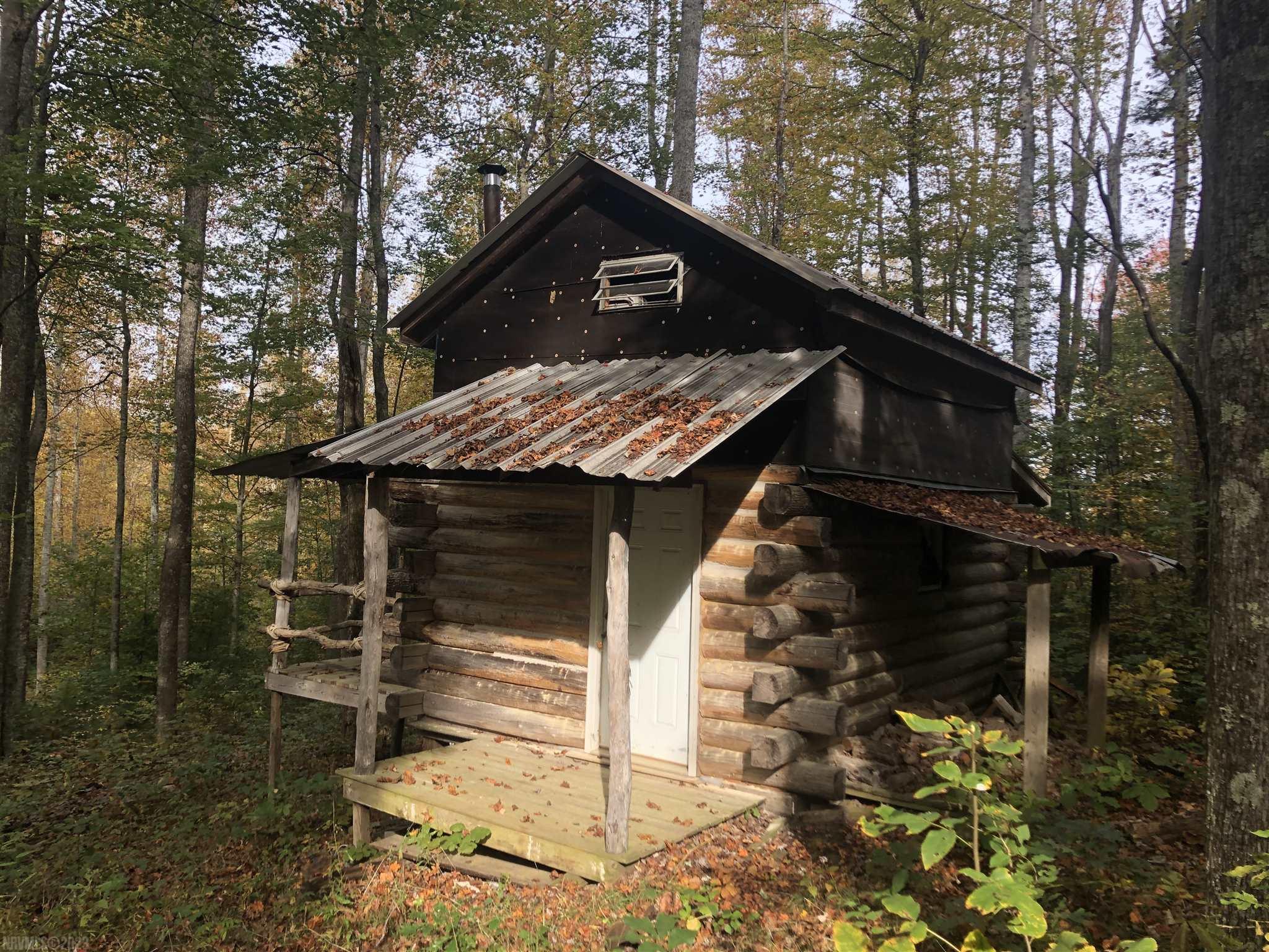 Peace and quiet in beautiful Floyd County, Virginia. Time to get away from it all, rest and relaxation and stretch your wings at this +/-45 acre wooded property. ATV/Walking Trails throughout and a quaint rustic cabin (no power, no septic, no water, no people) with covered deck. Located only 20 minutes to Hillsville and less than 25 minutes to Floyd.  Power available.