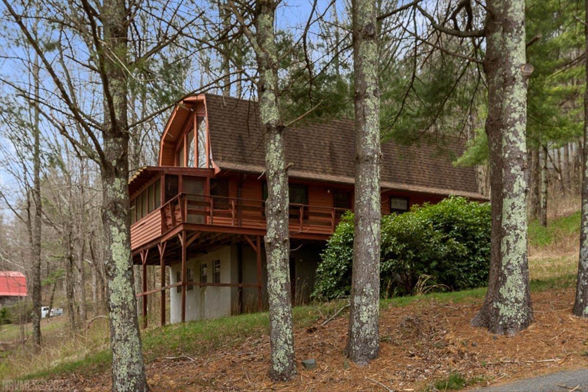 Charming 3 bedroom Cabin just off of the beautiful Blue Ridge Parkway!  The main level features an open floor plan with vaulted ceilings, huge windows and a brick fireplace in the living room that opens out to a large covered deck overlooking the mountains.  The master bed and bath are also on the main level.  Upstairs are two additional bedrooms and a half bath.  The unfinished basement is perfect for storage or could be finished for additional living space.  Just off the parkway this mountain home is close to wineries, golf, campgrounds and so much more that the Blue Ridge has to offer!