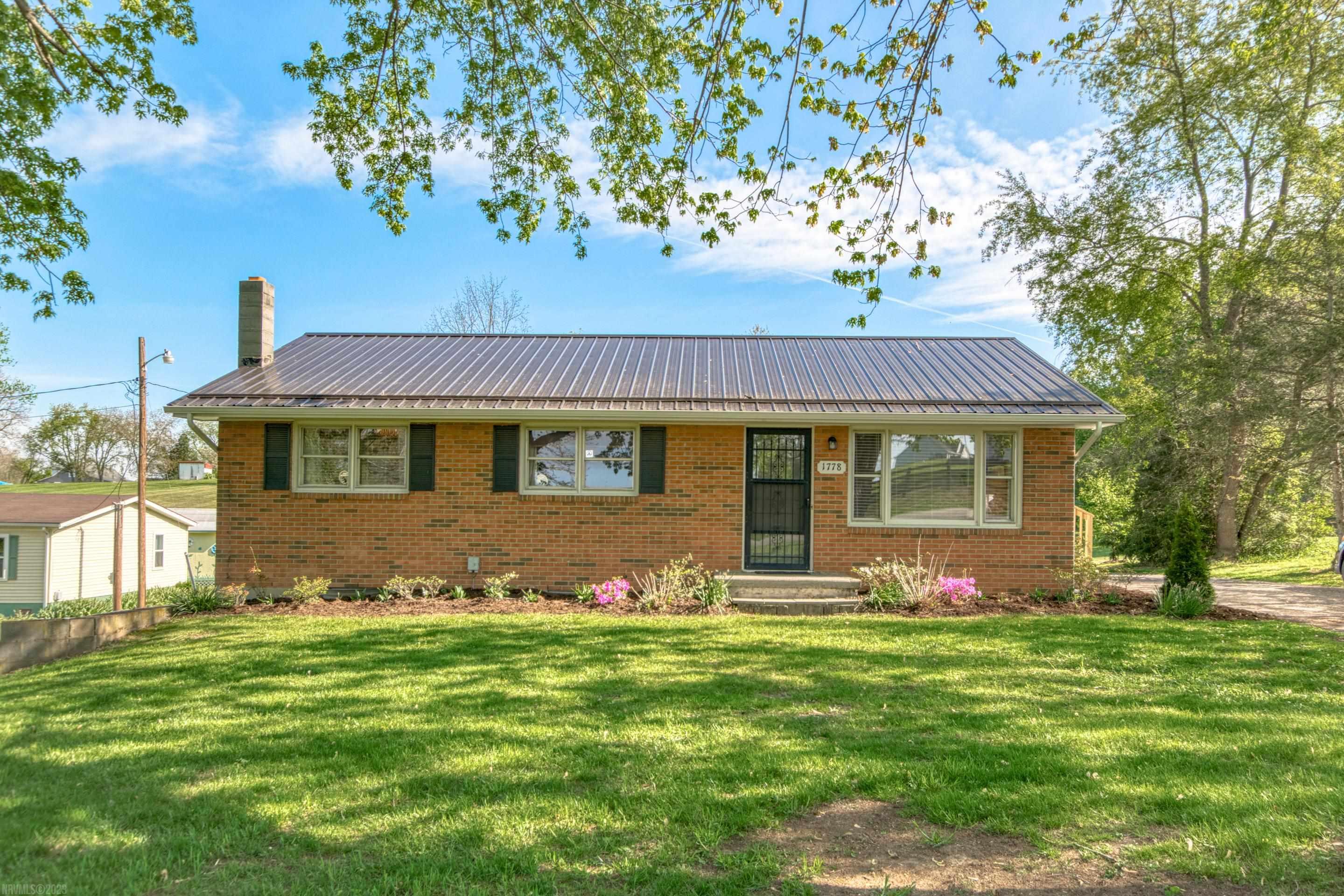 This is the one you've been waiting for! Located on almost an acre lot, this beautifully updated brick ranch is within walking distance to Auburn schools! A fenced in lot for the dogs, gardening space, a new metal roof, new floors and a full walk-out basement are just a few features it offers! Schedule a showing before it's gone!