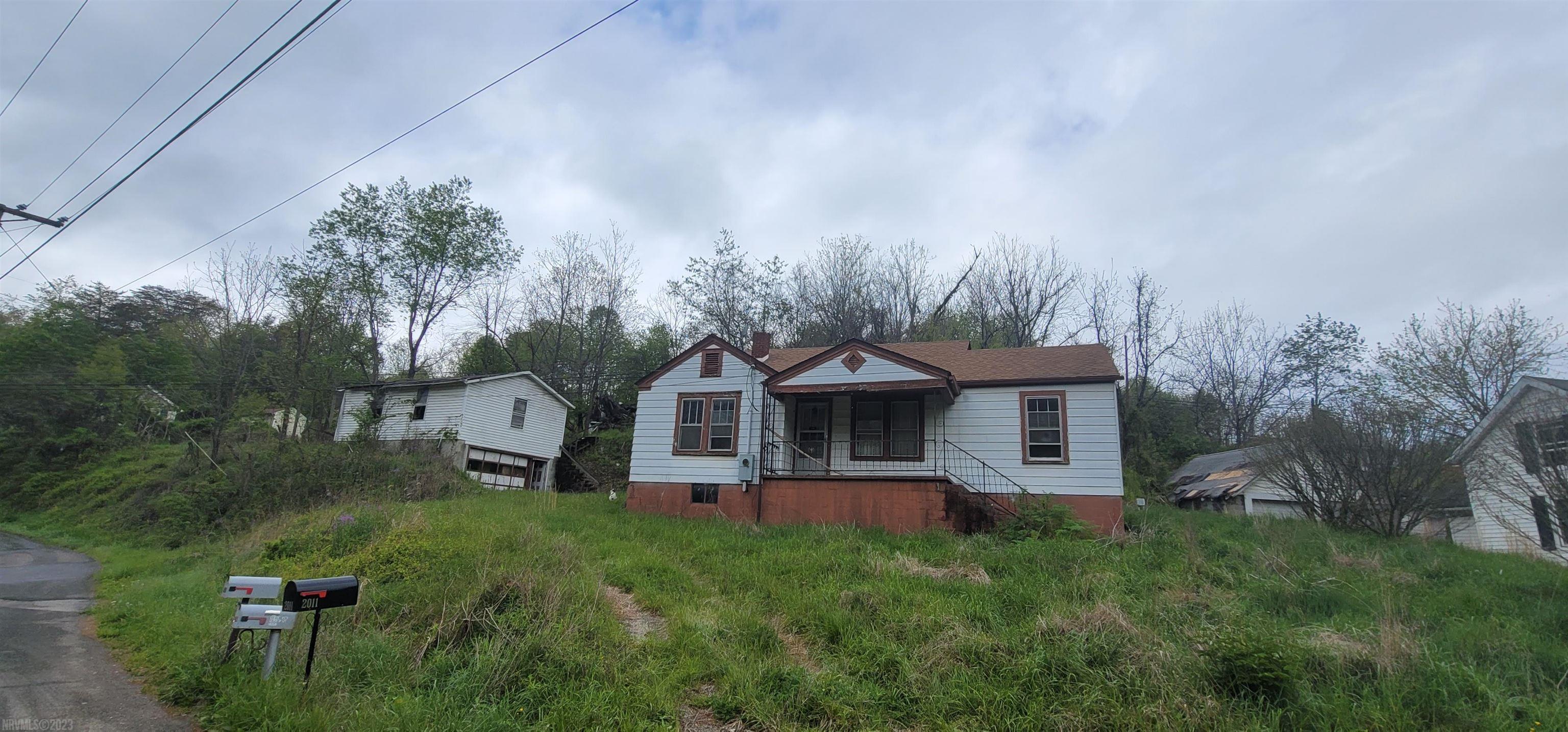 This property has huge potential with over two acres of land and over 250 ft. of road frontage you can build your dream home here, repair the existing house; rent it out or flip it; there are multiple options here. The home is a three bedroom one bath handyman project, with newer roof, newer septic system, new wiring and a detached garage.