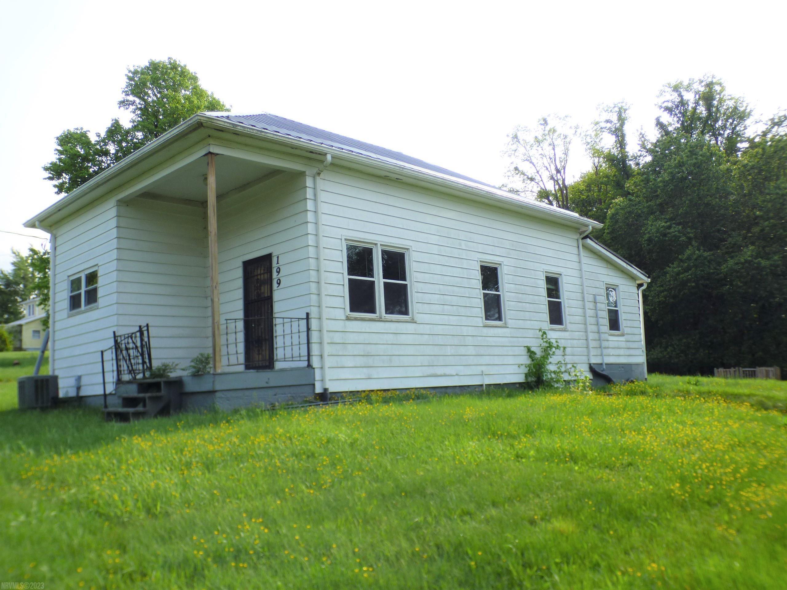 This charming cottage was originally a schoolhouse. New metal roof and heat pump are in place.