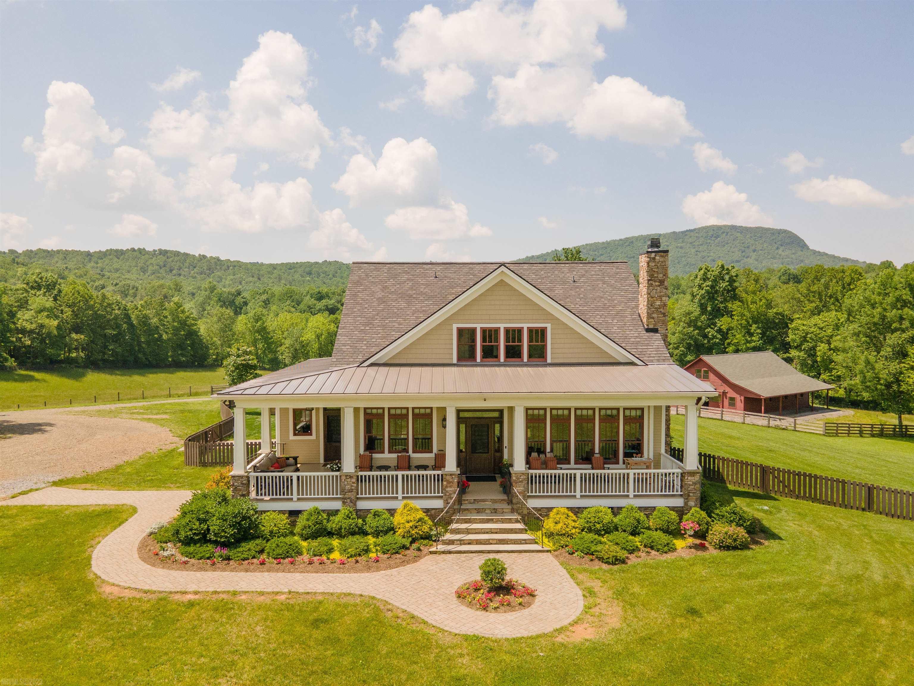 Welcome home to this spectacular horse property nestled in the Blue Ridge Mountains near Floyd Virginia. Hailed by Southern Living and USA Today as one of the South's Best Small Towns. Four miles from the Parkway, close to wineries and the exclusive Primland Resort. With 105gorgeous acres and stunning 360-degree mountain views, this farm has hosted weddings and horse clinics. Two luxury homes, two barns, upscale barn apartment and large arena. The primary residence, completed in 2017, boasts exquisite indoor-outdoor living at it's finest and breathtaking views from every room. High-end luxury finishes throughout create a warm atmosphere that make this home truly special. Guests will love the serene setting of the restored farmhouse. From the spring-fed bass pond to the apple orchard, this house has a charm all it's own. The main barn, built in 2020, is a horse lover's dream. Gorgeous floor-to-ceiling tongue-and-groove pine & air conditioned tack room, rubber pavers & wash stall.