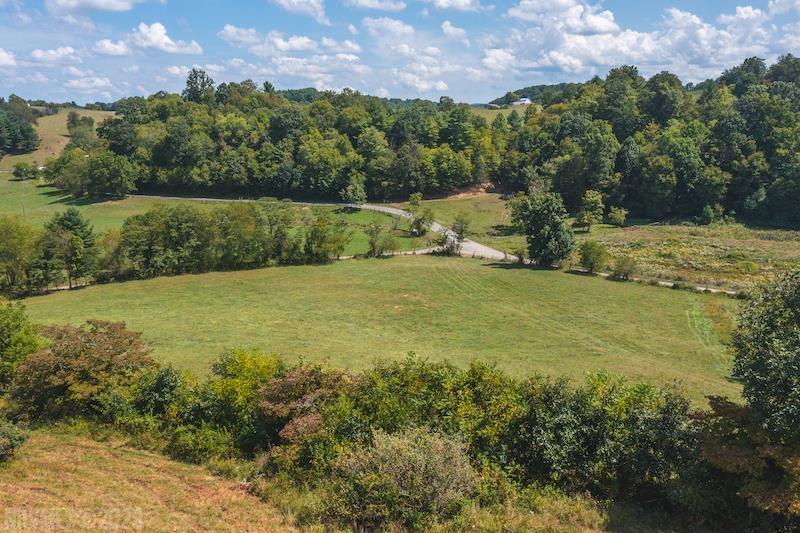 Have you been searching for a place to build your forever home? Check out this 11.185 acres of mostly open land. The property features building sites, 302' of road frontage, and beautiful views. Property is already fenced and gated making it great for a minifarm. Property has been perked. There is a small spring branch on property that would be great for sustaining livestock and wildlife. There is a 50' ROW that allows access for the adjoining lot. This is known as Lot 1 on the survey. High Speed Fiber Internet Ready and Available.