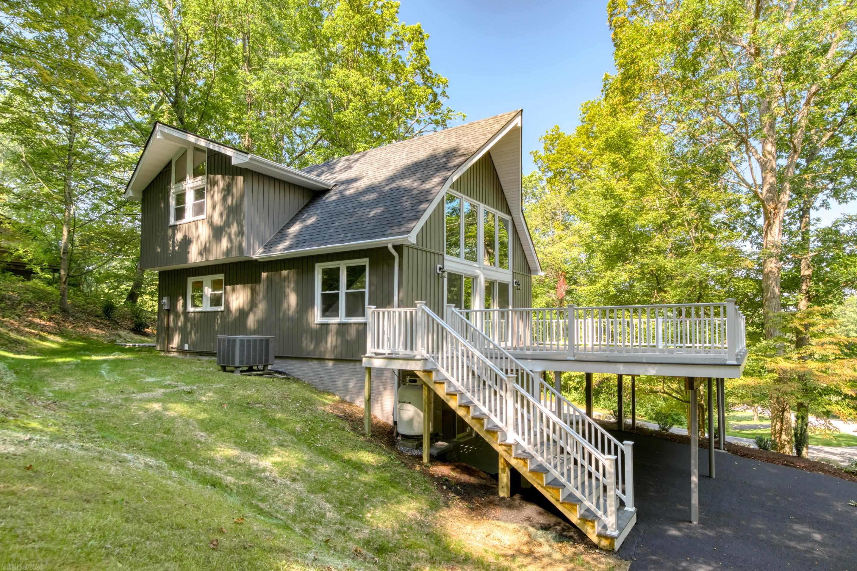 Beautifully updated contemporary style home in Craig Mountain subdivision.  The great room opens to an extra-large deck for outdoor living.   The dining room opens up to a new paver patio.  The bonus room on the lower level could be used as a 3rd bedroom (window does not meet ingress/egress).  No need to worry about cold weather since there are 2 gas log fireplaces.  Some on the updates include:  new siding, windows, cabinetry, quartz tops, appliances, floor coverings, Trex decking, vinyl railing, electrical and landscaping.  The bedrooms are extra large so furniture placement will be a breeze.  Parking available under the deck.  The home is bright and has plenty of space for everyone to have their privacy.  Roof replaced 2021.  HVAC replaced within the last 5 years.  The home is truly in move in condition.