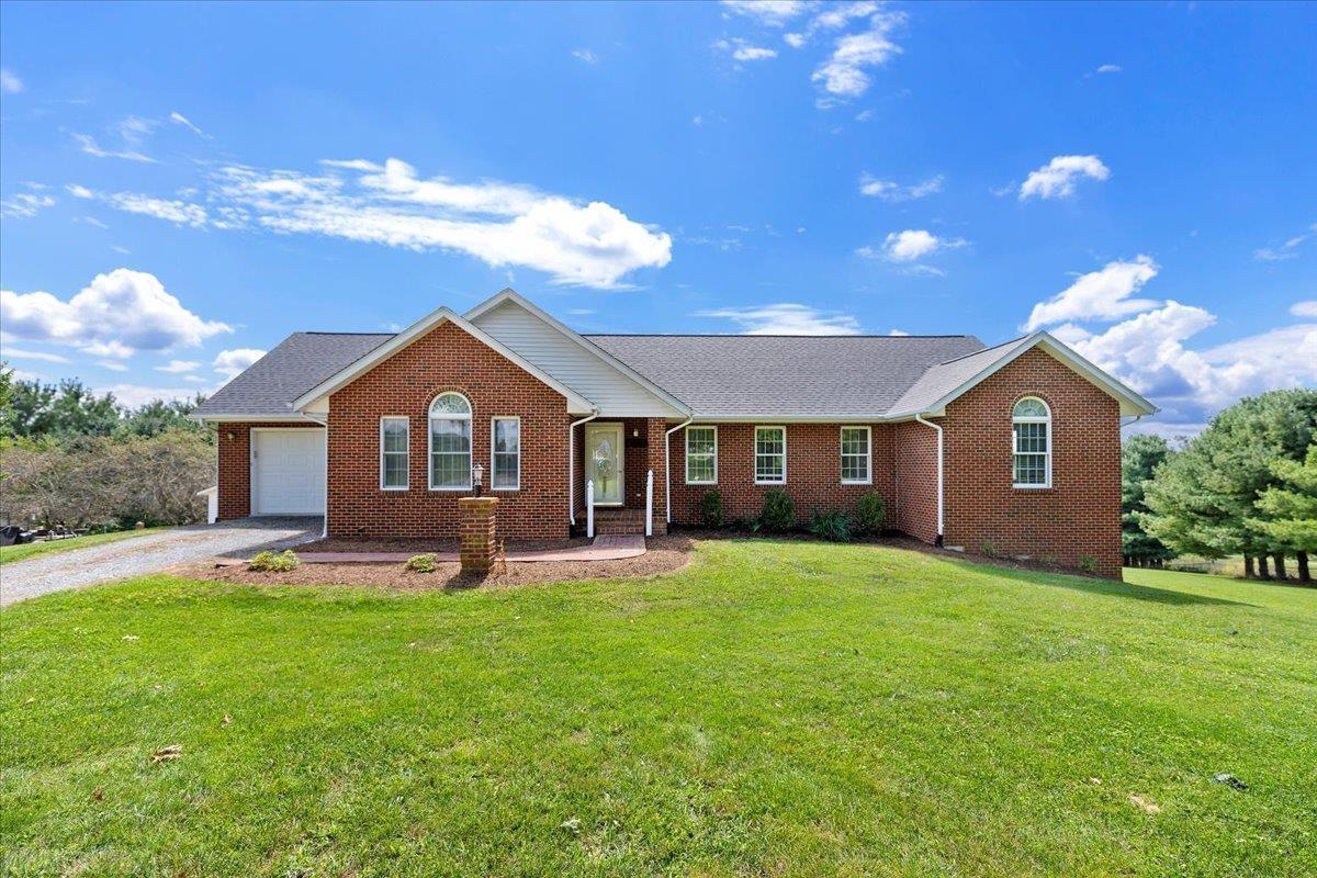 This solid brick home has plenty of room.  The living room has vaulted ceilings with a stone fireplace.  The kitchen has plenty of light pouring in and has a new vinyl tile floor.  There is a lot of room for expansion in the lower walk out basement.  This home is located at the end of a cul de sac and boasts 2 plus acres in size. Very convenient to downtown Christiansburg or the interstate exit 114.