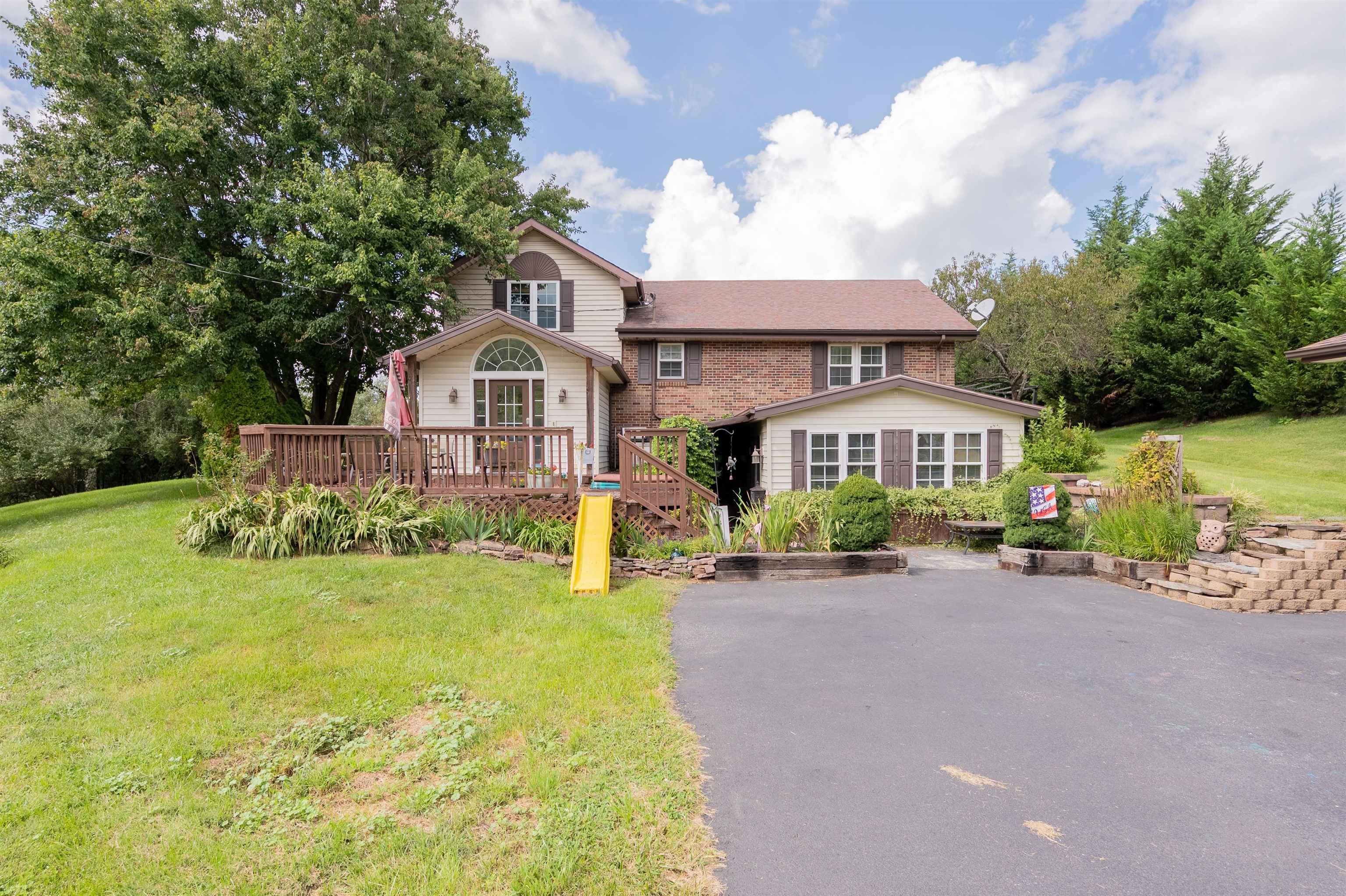 LOCATION!! Say hello to Miss Annabelle!! This gorgeous 4 bedroom 3 bath home in a perfect location minutes from Interstate 81. Are you looking for a generous sized home that has tons of room and entertainment space? Here she is. Walk into a beautiful foyer with ceramic tile flowing into the kitchen as well as the dining room which makes it perfect for a big family and entertaining not to mention this house has the ULTIMATE playroom upstairs over looking the front foyer. The kids WILL LOVE IT!  The kitchen has granite counter tops, stainless steel appliances as well as double ovens and the dining room has a wood burning fireplace too! Downstairs you have another bedroom, HUGE space for closet and living room. This home could easily be used as a 5 bedroom home as well! Property has several buildings and a super nice dog house for your furry friend! This place has endless possibilities and tons of potential for a growing family!! All it needs is YOU! Call for a showing!