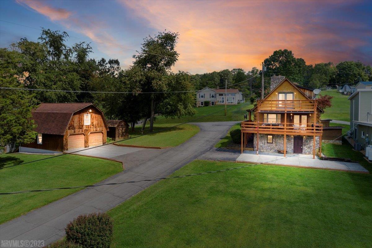 Discover the perfect retreat at our CLAYTOR LAKE Log A-Frame Home! This stunning property offers 3-4 BR's & 2.5 baths, providing ample space for all your needs. Enjoy the breathtaking beauty of Claytor Lake w/a MAGNIFICENT DIRECT VIEW from the comfort of your own home. This gem comes complete w/TWO Trex Decks, perfect for soaking up the scenery. Boating enthusiasts will love the convenience of a Private Boat Slip &Access to the Boat Ramp, both included w/the house. For those w/a penchant for cars & storage, a Det Dble Car Garage awaits, w/2 garage door openers/16 x 31 Rec room or extra BR. Additional storage needs are met w/a handy Storage Building on the property. Cozy up on chilly evenings by the Stone Fireplace w/a stove insert in the LR. Paved DW adds convenience to your daily life. The Full Unfinished Basement offers possibilities for customization. Appliances-Rnge/Ref/DW/W&D Convey. Whether you're looking for a year-round residence, a vacation home or Airbnb - Come See this!!!