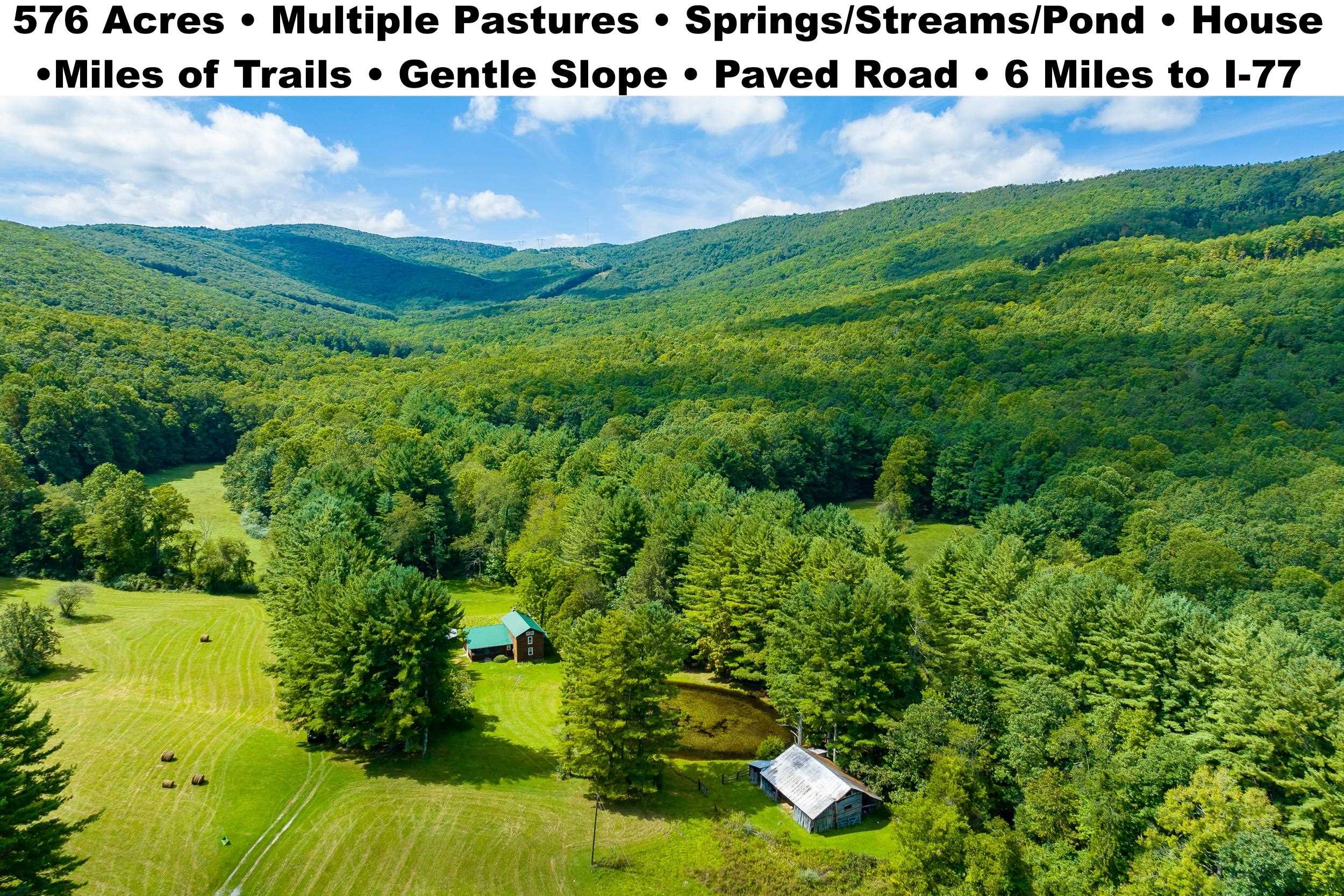 One of a kind property with endless opportunities! Laurel Fork Rd dead ends into this property making it easily accessible for everything from a sports car to an 18 wheeler. From the moment you reach the entrance you can hear the creek that runs through the property. The property runs from ridge to ridge with the northern ridge serving as the border between the two Virginias. The land is not too steep on either ridge, offering plenty of opportunities for whatever you have planned. Two log cabins were combined to make one home with everything you need. Outside the home is a large pond & older barn with the creek running behind both. There are multiple pastures separated by woods & easy to access with roads/trails. Between trails & old logging roads nearly the entire property can be accessed via riding or hiking. If you are looking for a secluded property with easy access, mountain views, an abundance of wildlife & plenty of water features, then this is the place for you.