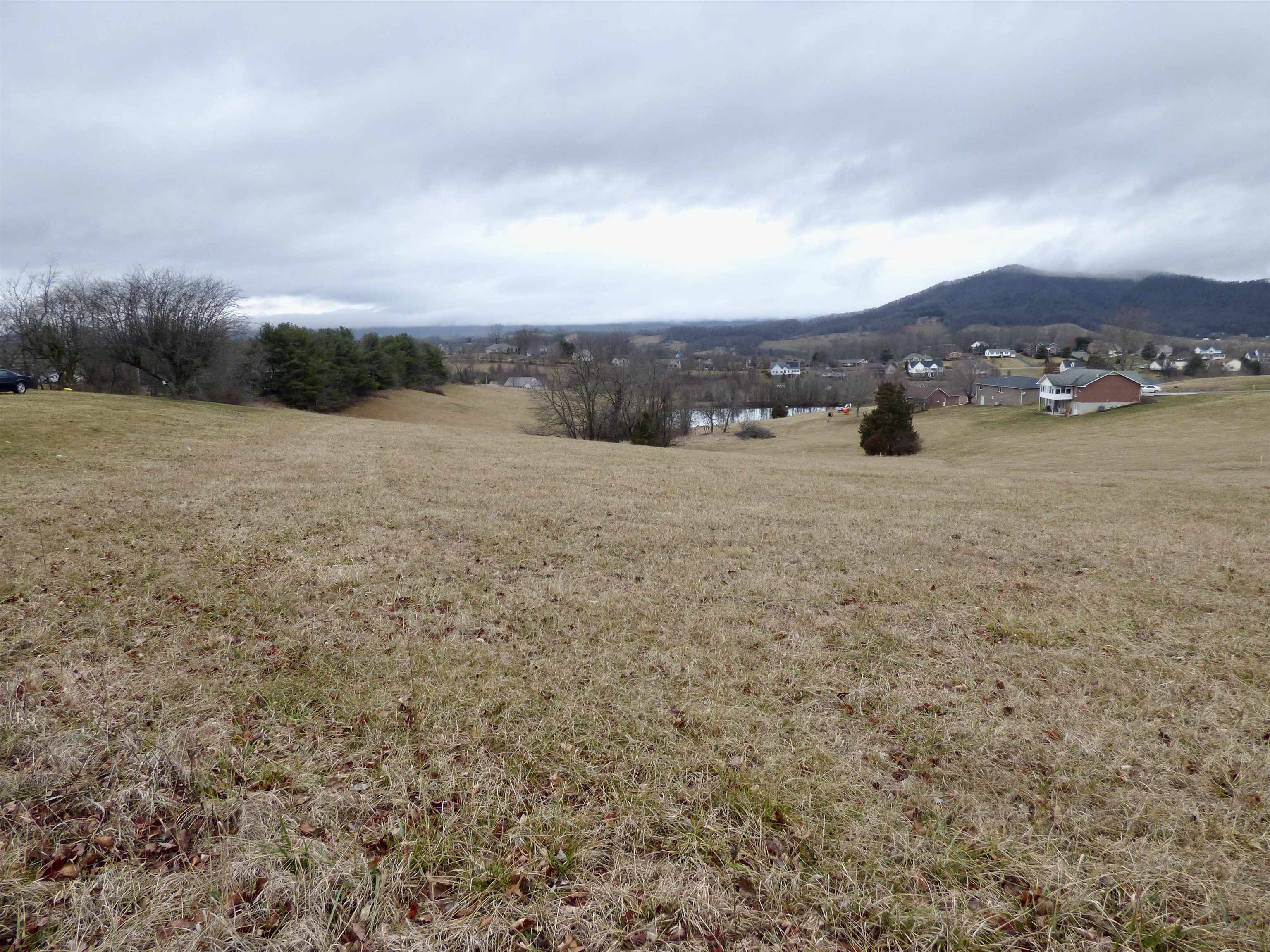 This .502-acre residential lot offers a great building site with mountain views and is zoned R1 for residential use. It's conveniently located with easy interstate access and has town water and sewer available. It is ideal for those looking to build a home in a scenic yet accessible location.