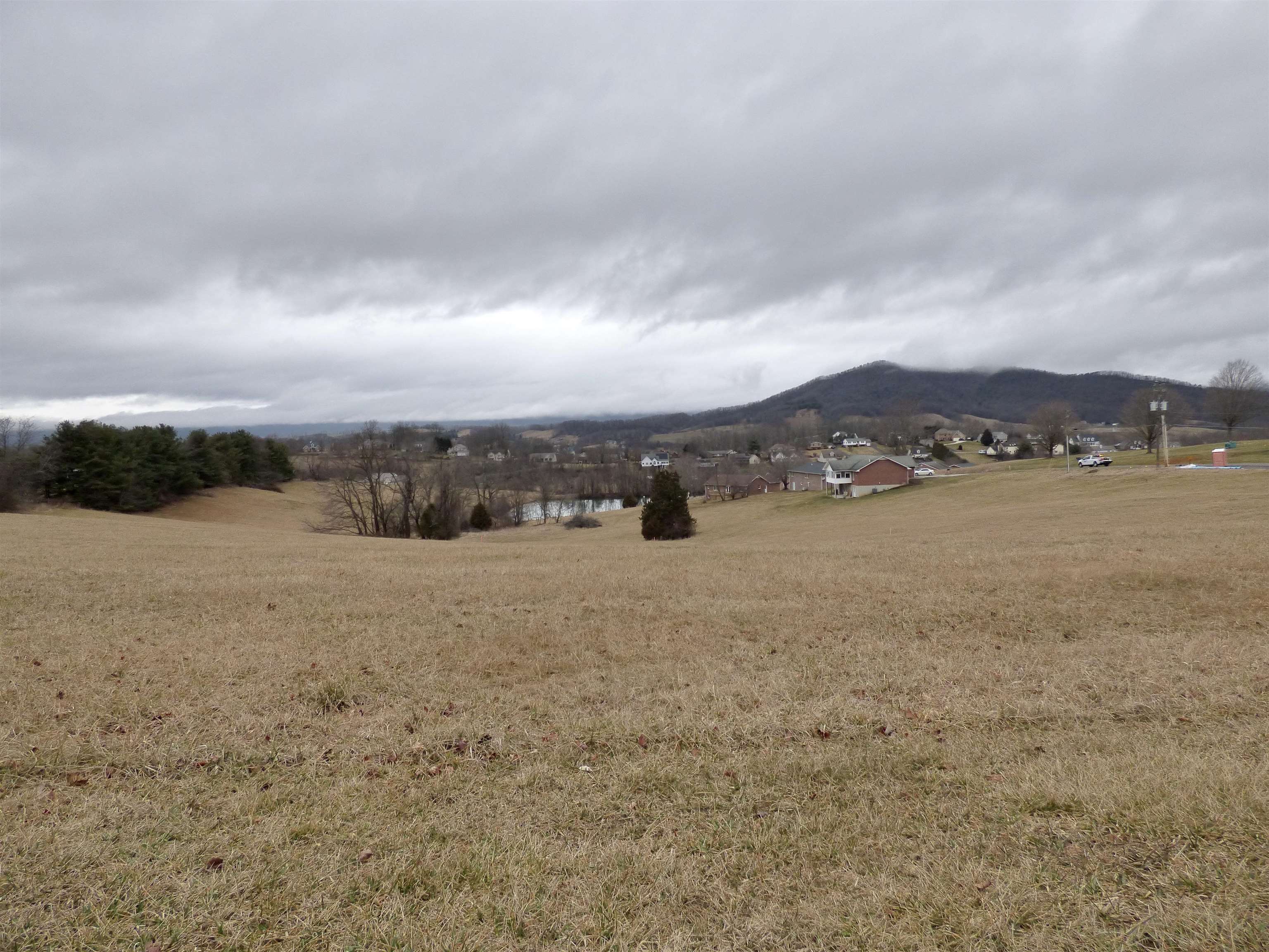 This .450-acre residential lot offers a great building site with mountain views and is zoned R1 for residential use. It's conveniently located with easy interstate access and has town water and sewer available. It is ideal for those looking to build a home in a scenic yet accessible location.