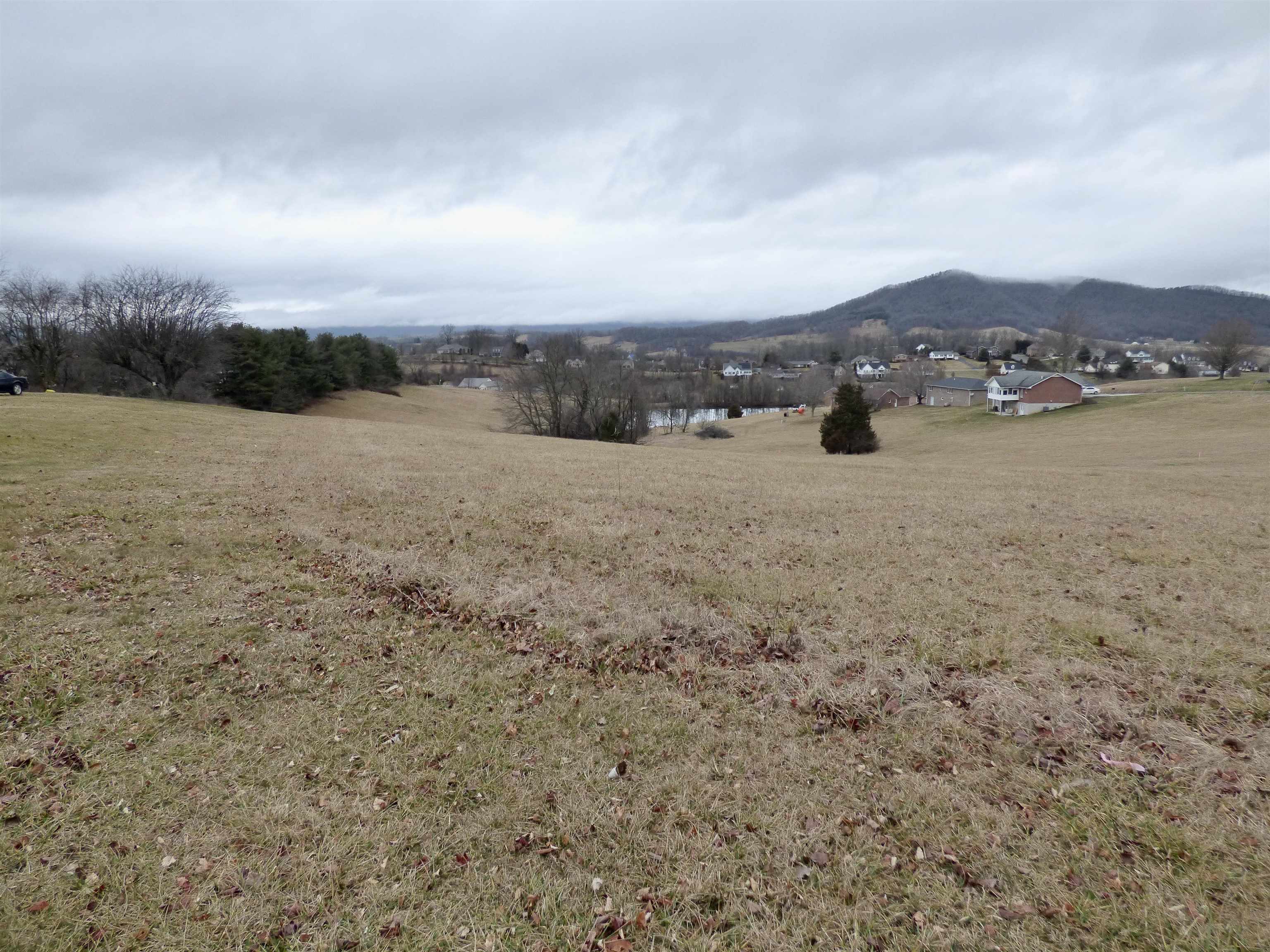 This .533-acre residential lot offers a great building site with mountain views and is zoned R1 for residential use. It's conveniently located with easy interstate access and has town water and sewer available. It is ideal for those looking to build a home in a scenic yet accessible location.