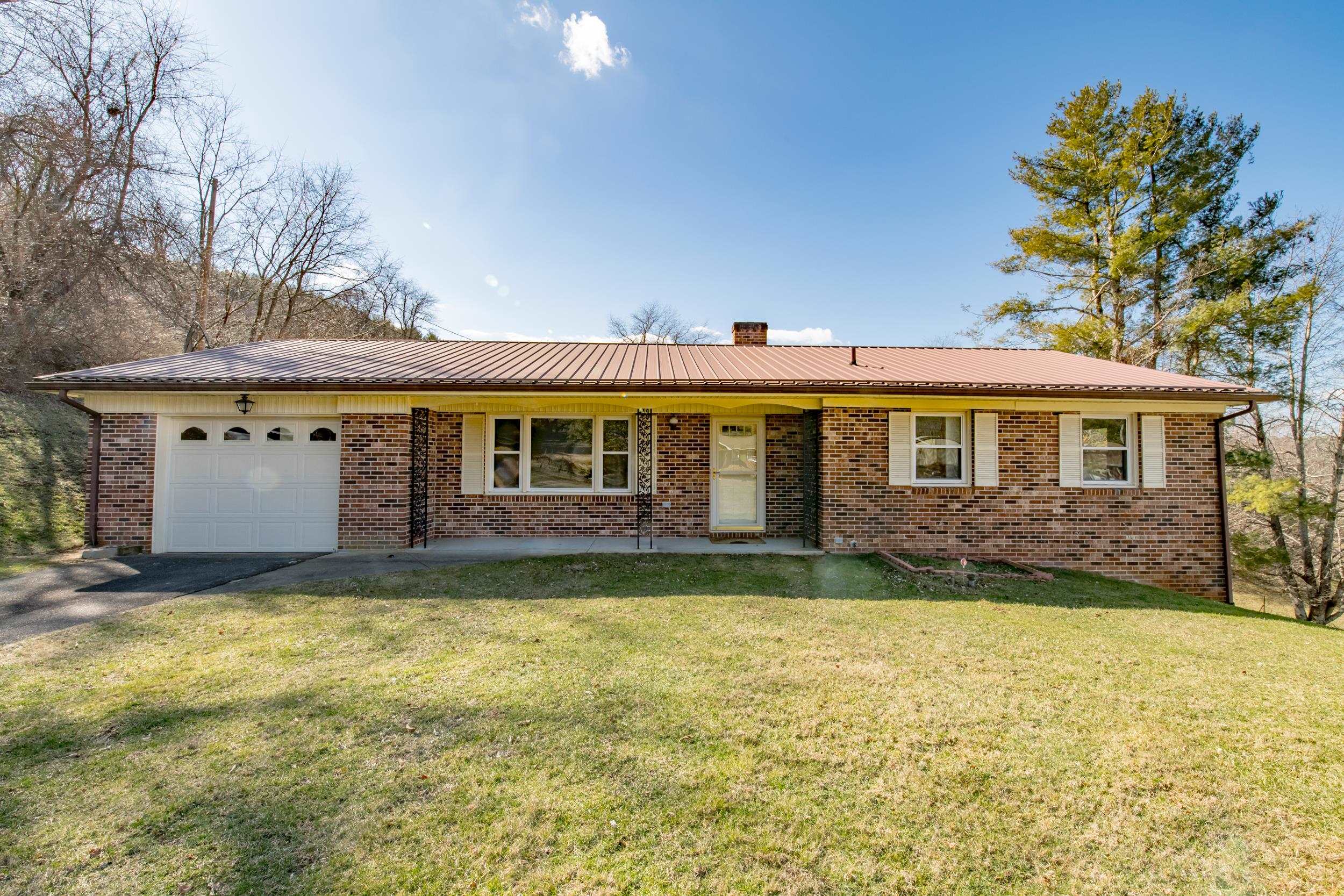 This is a beautifully remodeled brick ranch home in the town of Independence. You have a 1 car attached garage that flows into a bonus room and kitchen. The kitchen was designed with tons of custom features. You have a built in cutting board, knife drawer, and bread box. Most have pull out drawers in the cabinets as well. They don't make them like this anymore. The home is 3 bedroom 2 bath and is heated by an oil furnace, which is very efficient. The house is within walking distance to everything Independence has to offer, to include a well established farmers' market, and small town shopping. You're only about 5 miles from the New River, and about 1.5 miles to the beautiful waterfall called Peach Bottom Falls. The home has fiber optic internet available, since it's in town. You're centrally located with Blacksburg VA & Winston Salem NC both being about an hour and 20 minutes away. You're minutes from Jefferson National Forest. Independence is as cute of a town as it gets, too.
