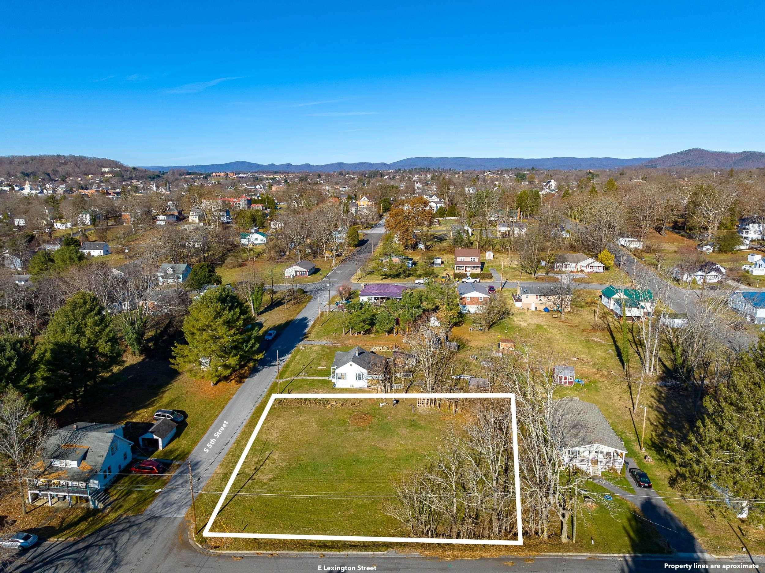 Have you been looking for the perfect lot to build on? This is it! This corner lot allows you to build a generously sized home while also providing a nice yard to enjoy, on a quiet street. You can also sit on your front porch and take in the views of the mountain as it shows off during the seasons. Or, use the lot as an investment opportunity to build multi-family housing and generate income from the property. Come take a look and picture the possibilities for yourself! Public Water and Sewer.