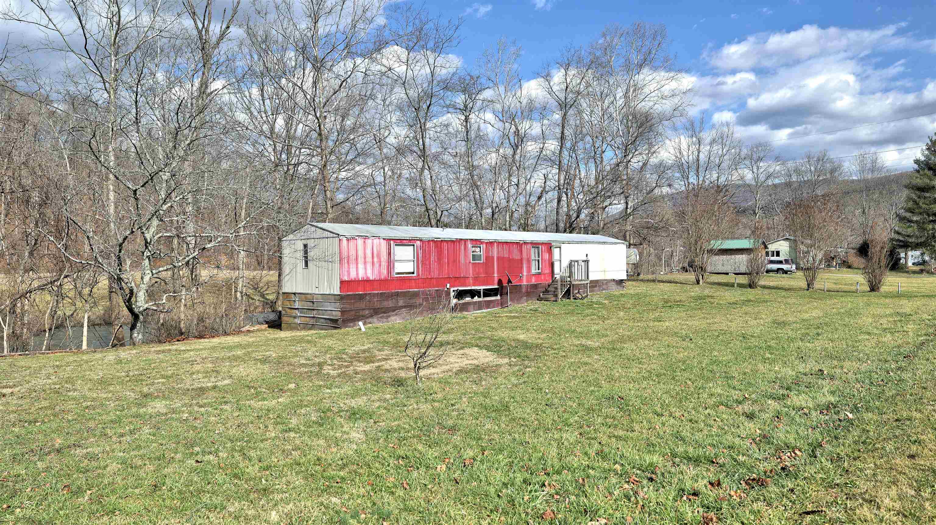 This handy man special has a three bedroom, two full bath, 1990 mobile home on a flat .3 acre lot just 3 miles from downtown Narrows and minutes to Rt. 460.  The home sits above the 100 yr mark flood plain and near the State Trout Stocked Stream Wolf Creek with lots of great fishing!  Great weekend vacation property, investment property or full time residence with sweat equity!  Additional adjoining property with creek frontage available.
