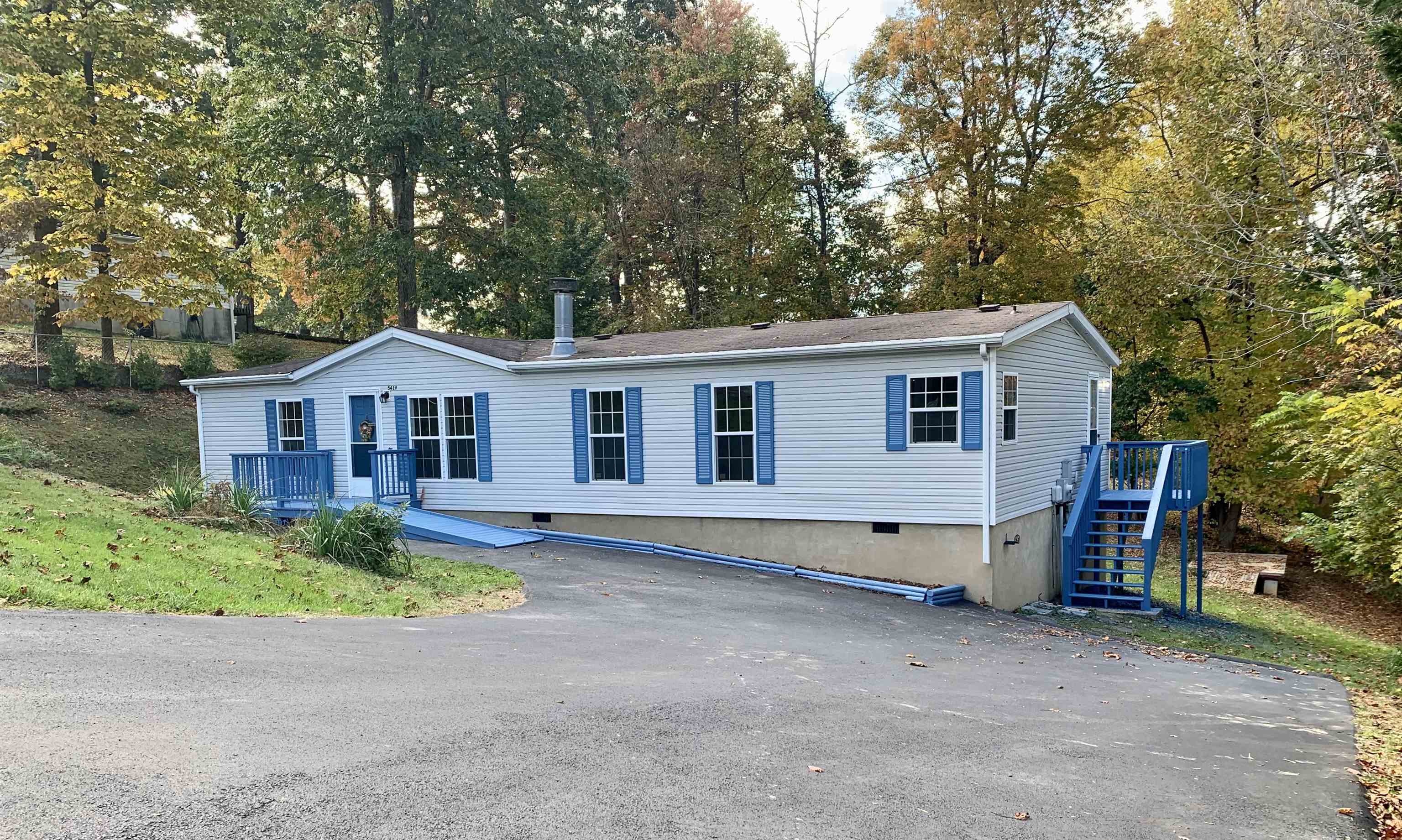 Newly remodeled home on a permanent foundation! This 3 Bed 2 bath beauty has new cabinets, countertops, appliances, tub/showers, floors, paint, and more. Located in a peaceful neighborhood with paved road and driveway. Home is only 15 minutes from Claytor Lake. The yard offers a private wooded setting to relax and enjoy. Storage shed in back. There is a large deck off of the kitchen, deck and stairs on side of home, and the front porch has a ramp. Meticulous craftsmanship throughout to save you from future projects. Home is currently being RENTED until Nov. 30th, 2024.
