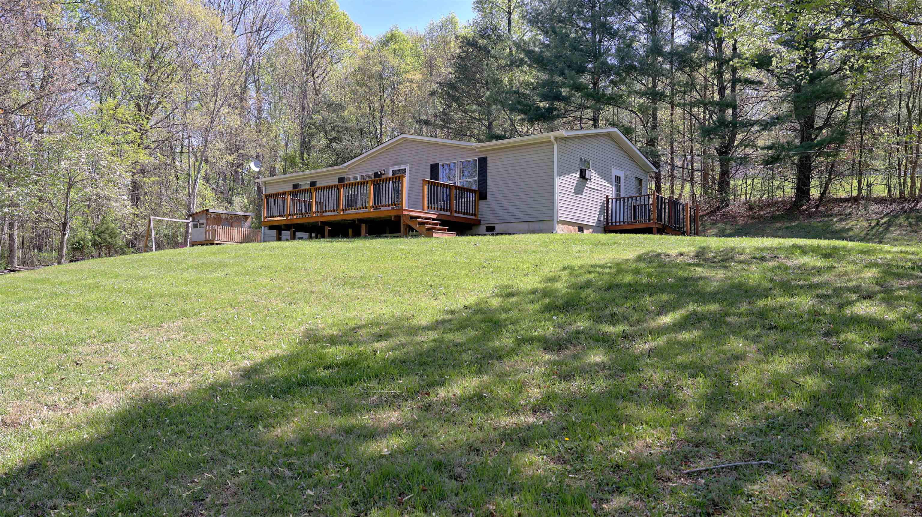 This updated three bedroom, two bath home sits on a private 1.422 acre lot surrounded by trees.  The new 16'x24' deck (2023) added on the front, updated primary bathroom (2023), updated hall bathroom (2020) and flooring, new range (2022) and dishwasher (2022) and a new roof added in 2013. Home is located on the outskirts of Christiansburg just minutes from Downtown Christiansburg, Blacksburg, VT, the Aquatic Center, shopping, restaurants & I-81. There is a large 12x20 storage building with roll up door too conveys. Great home for a first time home buyer or investor.