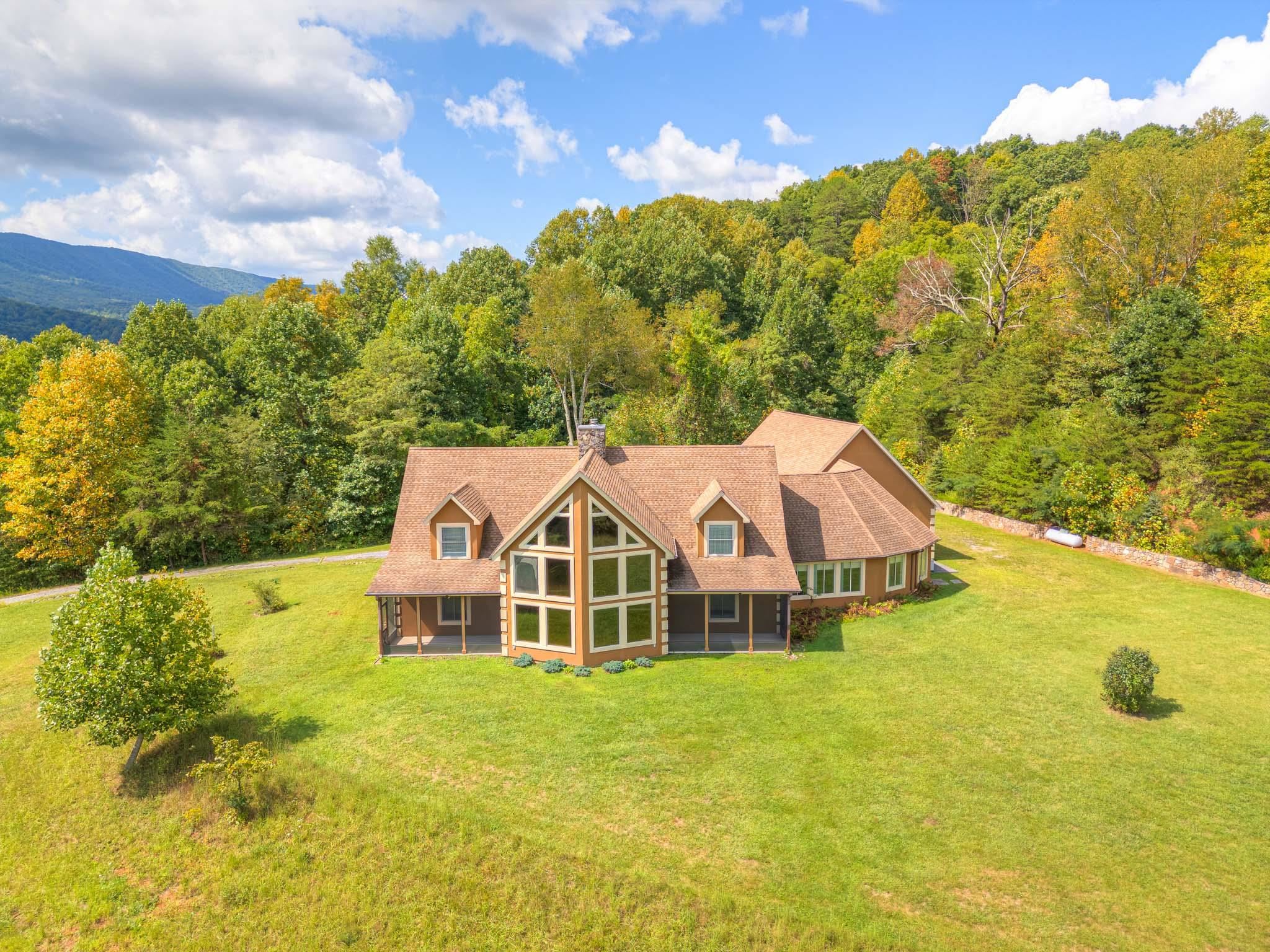Magnificent home situated on just over 154 private acres w/ pastoral & mountain views to be enjoyed from the wall of windows in the spacious living room w/ hardwood floors, cathedral ceiling & stone fireplace & built in generator. This three bedroom, two full & two half bath treasure has two screened porches, updated painting & flooring with a huge, gourmet kitchen w/ custom built hickory Amish cabinets, center island & all brand new Stainless Steel Kitchen-Aid Appliances . Perfect home for entertaining in the enormous family room. Primary bedroom w/ walk-in closet, beautiful bathroom & laundry are all on the main level. A huge floored attic is accessible permanent stairs from attached three car garage. The home overlooks hay field & could easily be fenced for horses, cattle, etc. There is abundant wildlife on wooded section that is behind the home w/ trails throughout. Located minutes from Celanese, West Virginia & 40 minutes to Virginia Tech & Blacksburg. Call for a private showing!