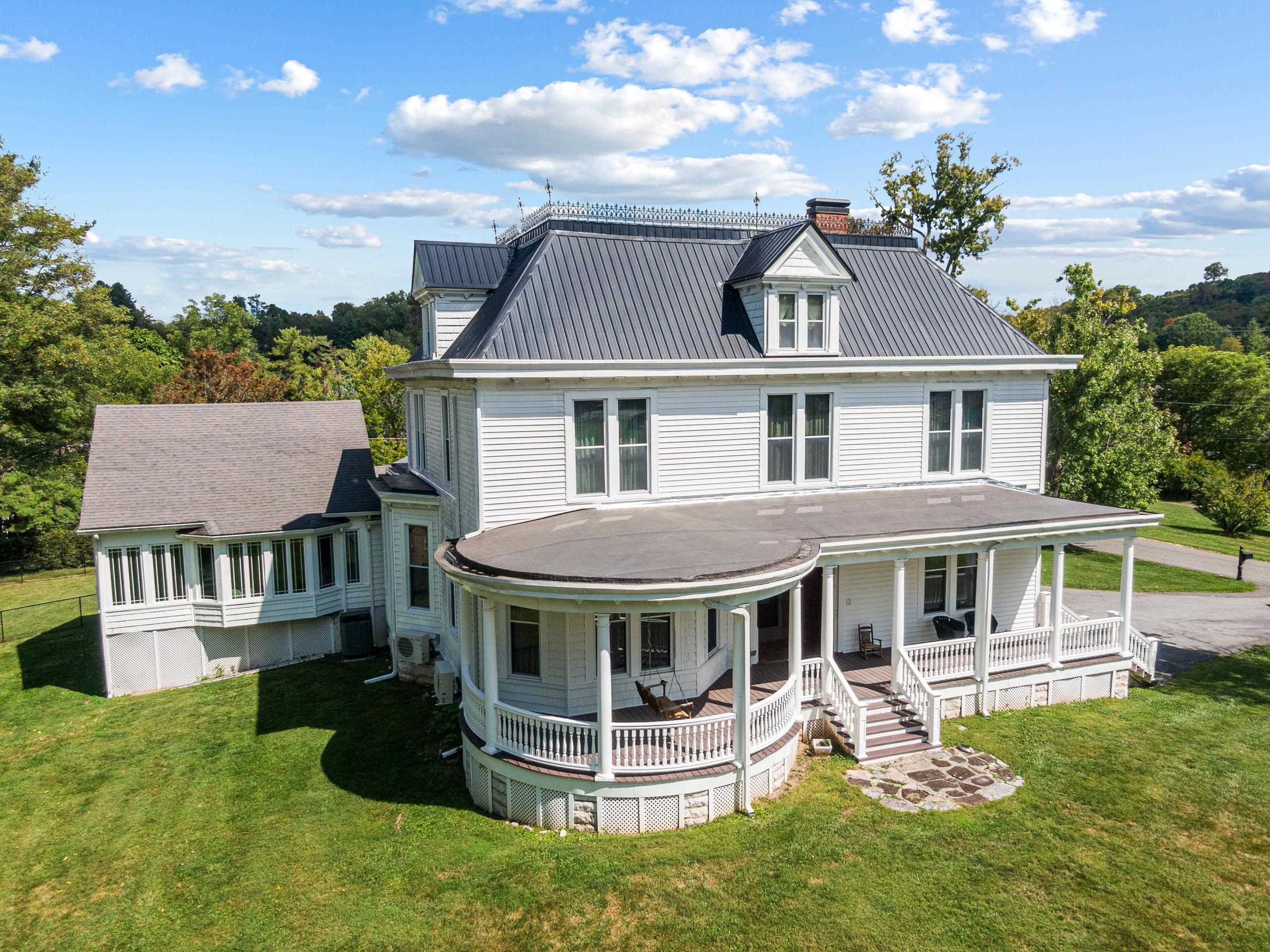 Immaculate turn of the century farmhouse in Tazewell, VA with easy access to downtown and shopping. This gorgeous home greets you with elegant wood working on the doorways and steps. Excellent potential for a Bed & Breakfast located less than 4 miles away from the Back of The Dragon, Virginia's premier motorcycle riding road on the East Coast and 40 minutes from the Hatfield McCoy ATV Trails. This home boasts hardwood floors, high ceilings, and large windows. Bedrooms are comfortable and warm, while the bathrooms offer modern fixtures and finishes. The Four Seasons room is perfect for entertaining or just relaxing throughout the year. Enjoy a large yard with mature trees perfect for gardening, entertaining, or relaxing on the porch. 2024 Updates include Mini-Splits, Electrical, and more!