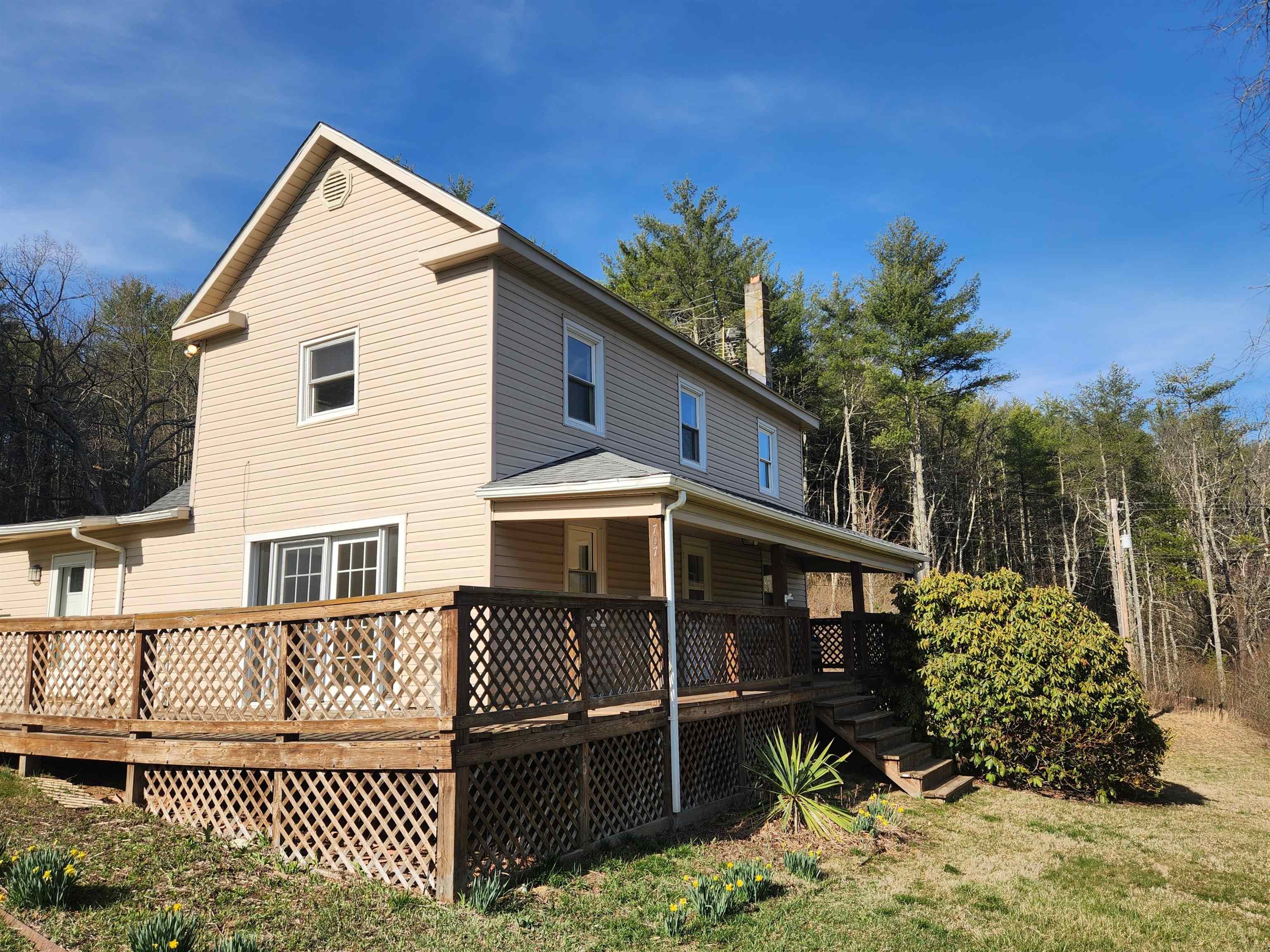 This great listing is back on the market due to purchaser not being able to obtain their financing. Not your typical farmhouse home.  Step in to this 3 bedroom updated home built in 1870.  Primary bedroom on the main level along with large kitchen and oversized laundry.  The upper level has 2 bedrooms, a storage room and the large floored attic.  The property includes wooded acreage with trails cut through for ATV's, hunting or hiking.  Custom cabinets in the oversized kitchen.  New roof on all buildings.  Updated siding, insulation, electrical, plumbing, doors and windows.  The large 2 car garage has electric.  The root cellar/storage building has electric and is great for canned goods.  Property serviced by an artesian well but also has a freshwater spring.  Peace and tranquility are waiting for the new owner of this property.  Abundance of blackberry bushes and black walnut trees.  Definitely worth a look and the opportunity to enjoy the serenity that the property has to offer.