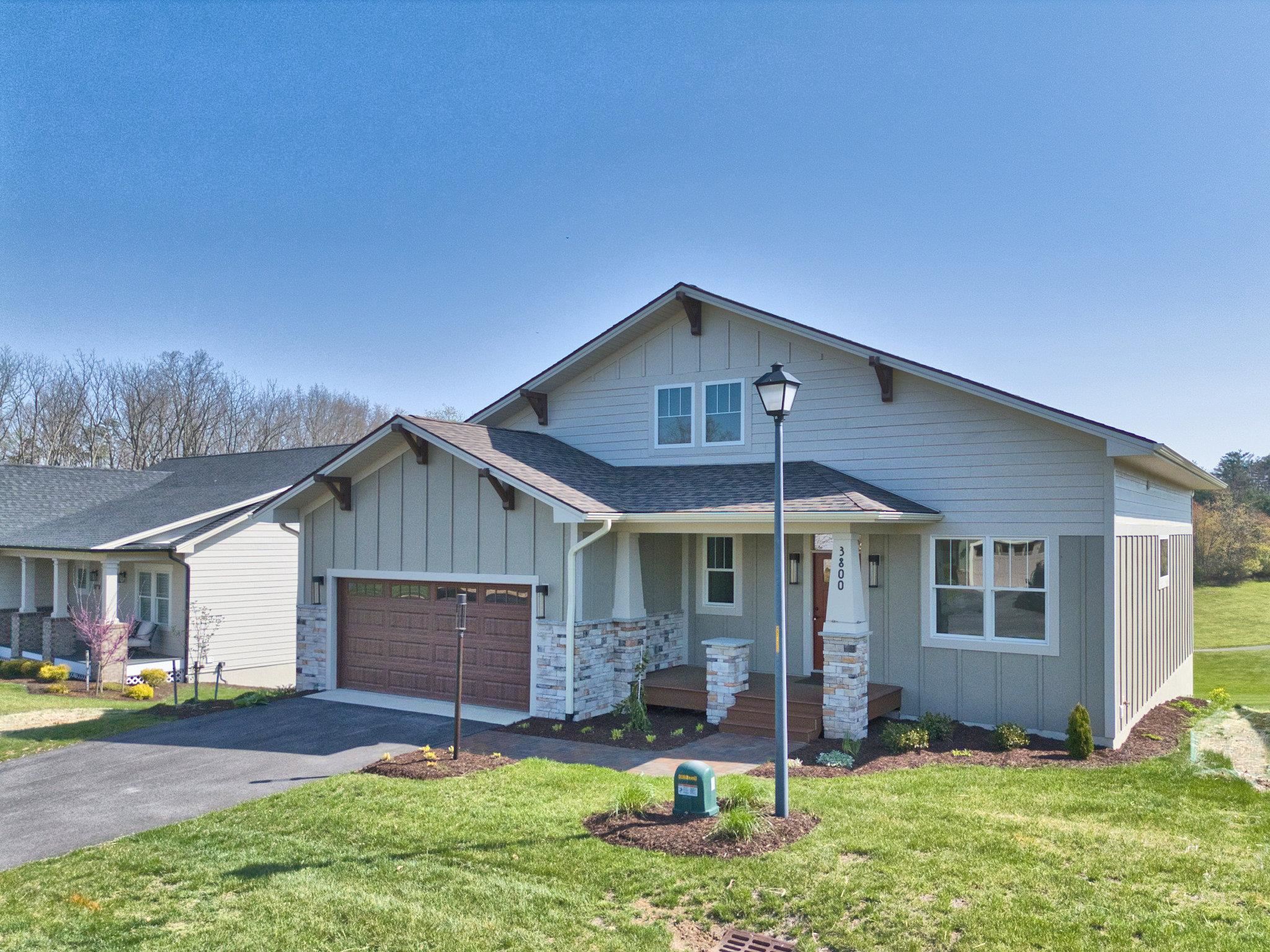 Golf course living at its BEST in this newly constructed, gorgeous, four bedroom, three bath, one level, Craftsman Style home overlooking the 16th hole of Auburn Hills Golf Community from the rear trex deck. This home has been carefully crafted by one of the Premier Custom Home Builders in the entire New River Valley Region! The open floor plan boasts a large living room, dining room & Chef's kitchen w/ island, coffee bar area & walk in pantry. Custom designed w/ hardwood flooring & high-end finishes throughout. Natural light pours in through the abundance of windows. Primary bedroom on main level has walk-in closet, elaborate bathroom w/ two separate sink vanities & tiled shower. Second bedroom & laundry on main level. The walkout lower level has two additional bedrooms, family room, third full bath & lots of unfinished space for storage and/or potential additional living space. Relax on the rear concrete patio below the deck w/ mountain views & hole #16. Move in ready! Must see!