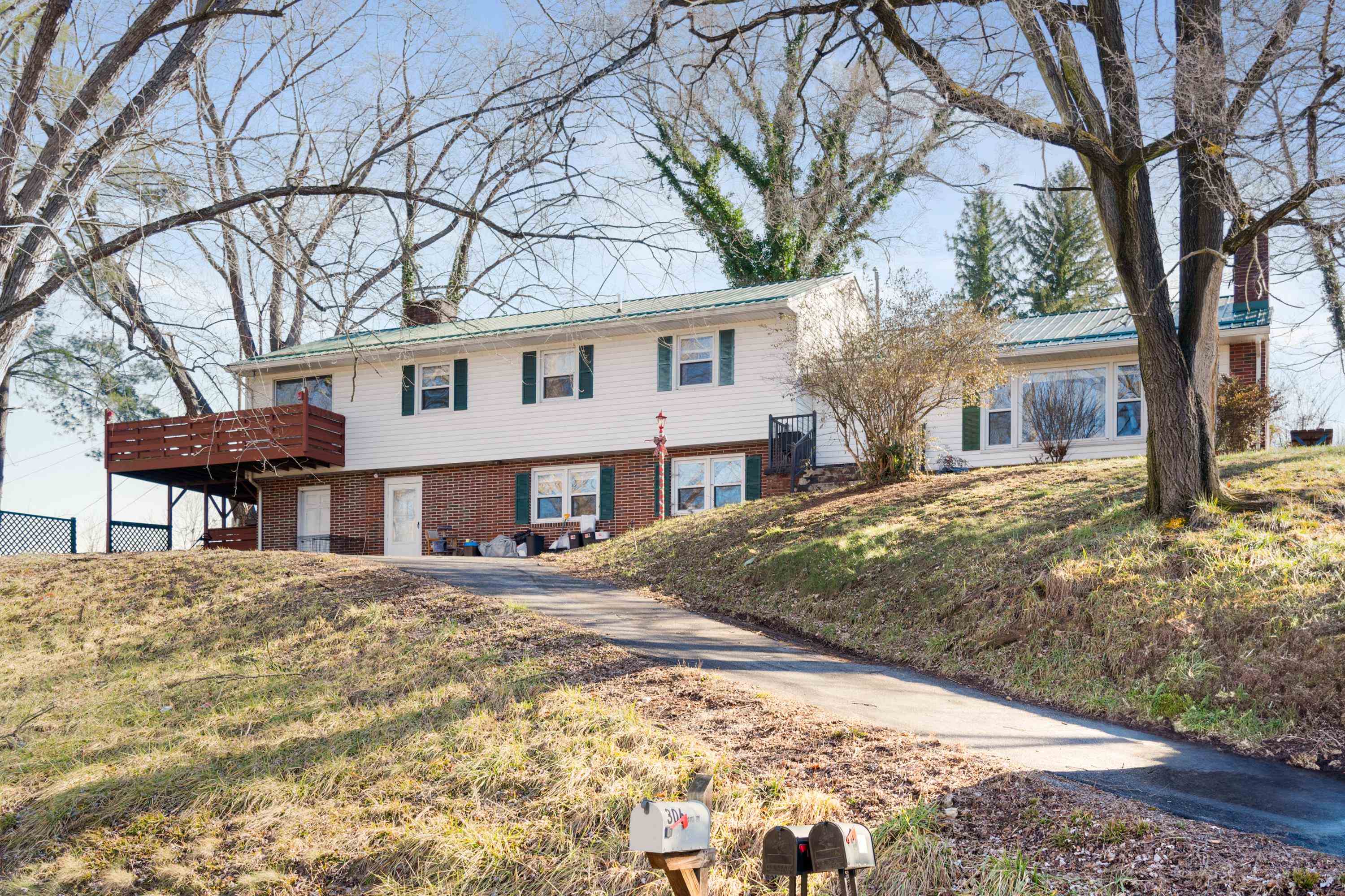 Step into this sprawling 4 bedroom, 2.5 bathroom home tucked in a quiet neighborhood in Pearisburg, just waiting for a new owner to add their personal touch. The main level is perfect for entertaining with a spacious living room connected to the dining room and a large kitchen.  The top level features hardwood floors hidden beneath the carpet, ready to be revealed. The master bedroom has a fireplace, walk in closet and doors to the porch.  With a functional layout and a peaceful yard, this home is full of potential. Major updates include a new HVAC system and water heater (2023) and a roof replaced within the last 10 years. Don’t miss your chance—schedule a showing today!  Please note, Sellers are still working to remove personal items.