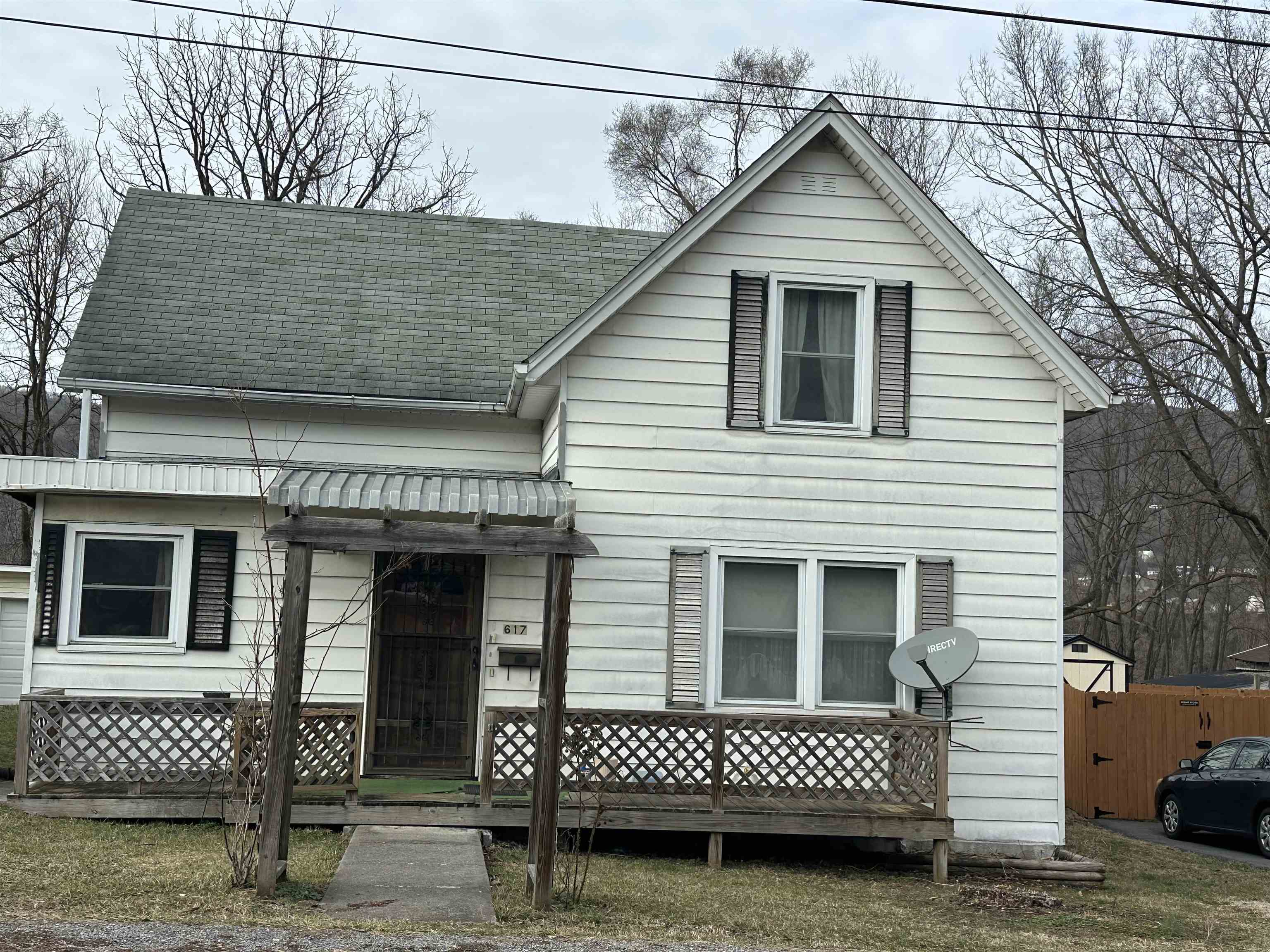 Older home, with nice level yard, screened porch.