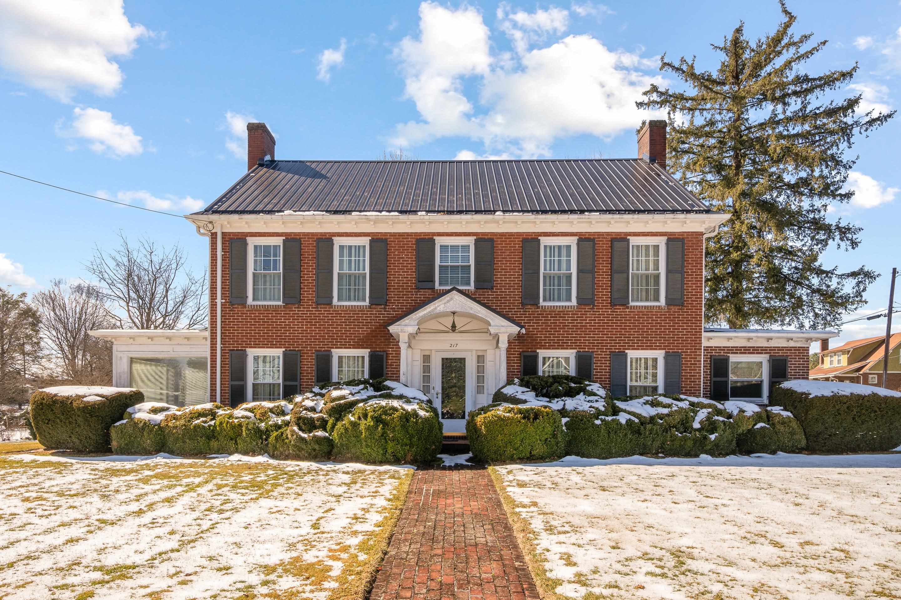 Step into a piece of history with this beautifully maintained 4bdrm/2bth 1930s home in the heart of Dublin! Bursting with character and charm, this home offers unique features such as the original kitchen cabinets and a built-in cutting board from the 1930s, offering a rare glimpse into the craftsmanship of the past. Other features include a bright sunroom, an unfinished basement for storage, and beautiful hardwood floors.  For those who need extra space, this property includes two double detached garages and a separate storage building—perfect for vehicles, hobbies, or a workshop. The large, flat lot provides ample room for outdoor activities, gardening, or entertaining. Stay comfortable year-round with two heat sources: a heat pump and hot water radiator heat, ensuring efficiency and coziness in all seasons. Enjoy peace of mind with updated windows and a newer metal roof, enhancing the home’s durability while maintaining its historic charm. Reach out to schedule your showing today!
