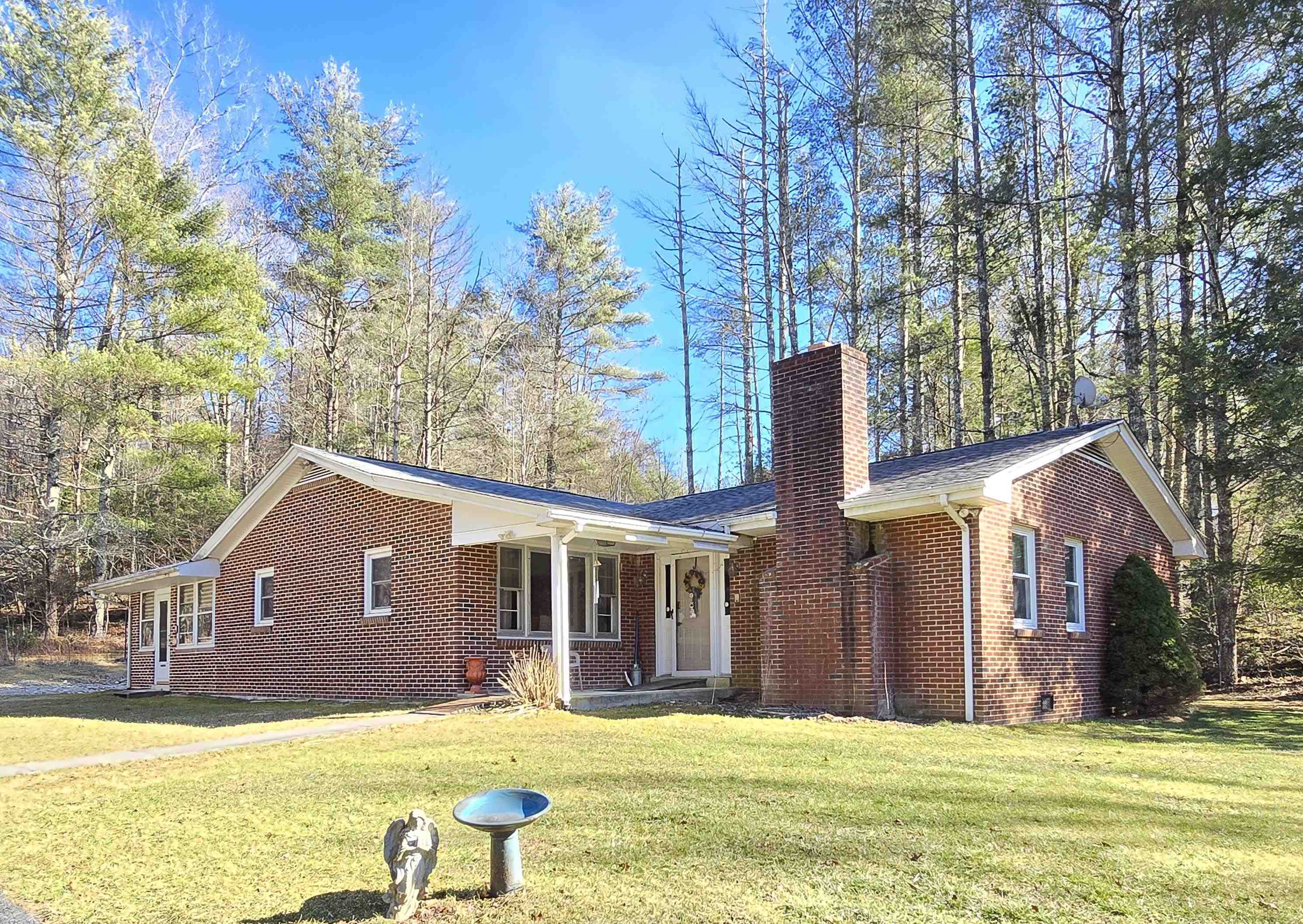 The stories, memories shared by Mom and Dad, the children and grandchildren growing up here in this quaint setting Called Home. This property features many of the amenities requested by families, single folks and retirees.  Where are the kids mom asked, on the phone? No they are up in the woods exploring and playing in the spring fed branch that flows through.  All can Enjoy the easy to maintain, mostly level yard and stroll out to the workshop that is conveniently attached to the carport. This home has been improved  for one level living.  Natural light floods the inviting, spacious living room and sunroom.  The property also features a fully prepared camper spot with electric and water hookups. One owner really means something . . .  clean & very nice condition. Amenities also include less than 5 miles to the famous country store, 10 miles to the Blue Ridge Parkway & 20 miles from I-81. Planning for retirement in Floyd County or a delightful area to raise your children? MOVE IN READY