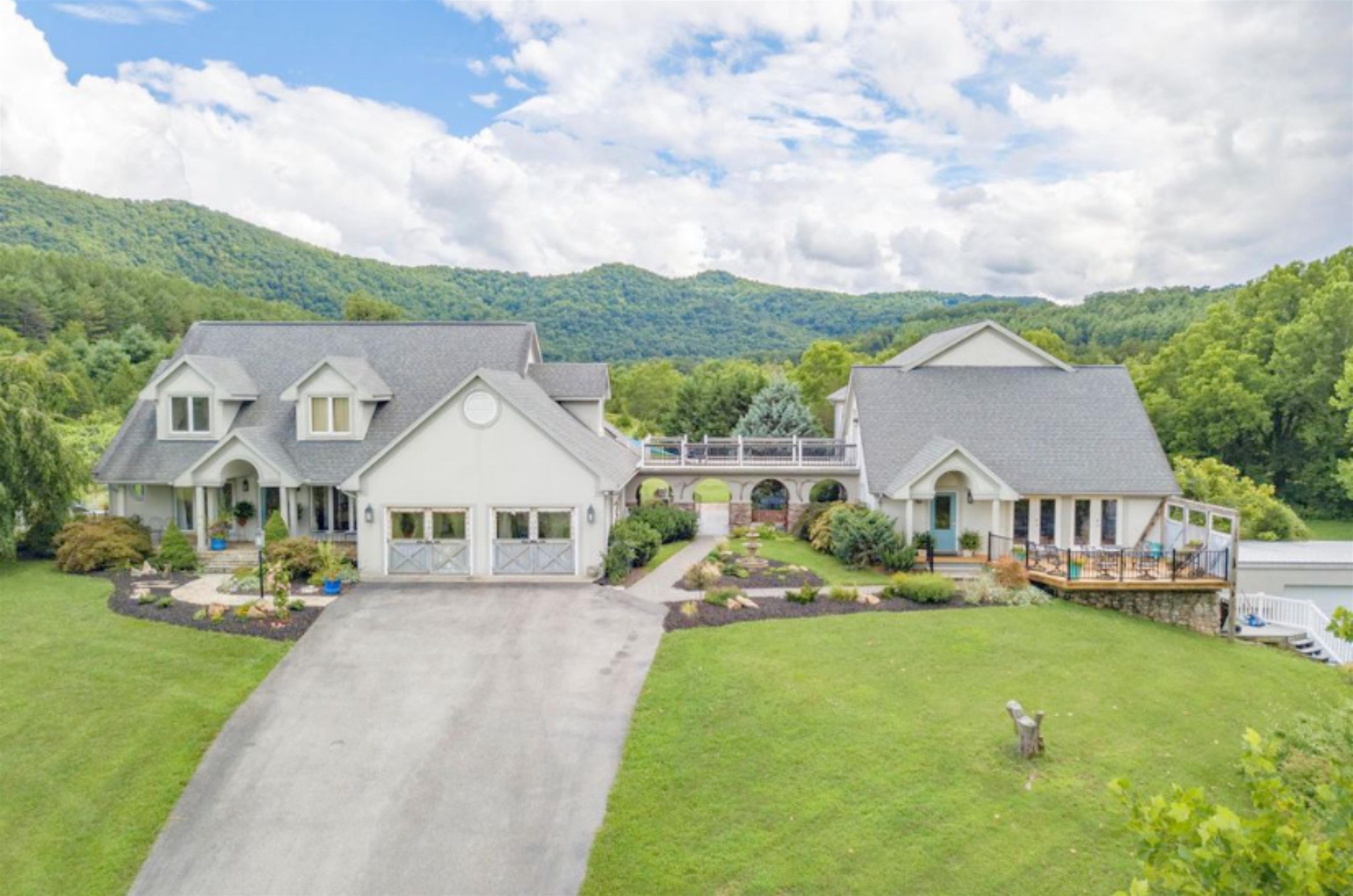 STUNNING MOUNTAIN RETREAT WITH VINEYARD, RIVERSIDE ENTERTAINMENT & BUSINESS POTENTIAL. Nestled in scenic mts min from Bburg, Salem, Roanoke. Easy access to 81. Designed to blend luxury with nature-situated on 36 private acres. Breathtaking landscape, bordered by serene river, creating peaceful picturesque setting. Working vineyard for wine enthusiasts and entrepreneurs, complete with tasting room-ideal spot for private events or expanding winery business. Endless potential-Airbnb, B&B, dream destination for weddings-retreat-special gatherings. Charming detached studio/office perfect for remote work, art, or guest accommodations. Enjoy breathtaking views and cozy evenings under the stars at the firepit & riverside haven. Expansive flat outdoor space for gardens, events, or even expanding the winery.  This rare gem is the perfect blend of privacy, natural beauty, income potential.  Whether you're looking for personal retreat-business venture-or both, this mtn paradise is waiting for YOU!