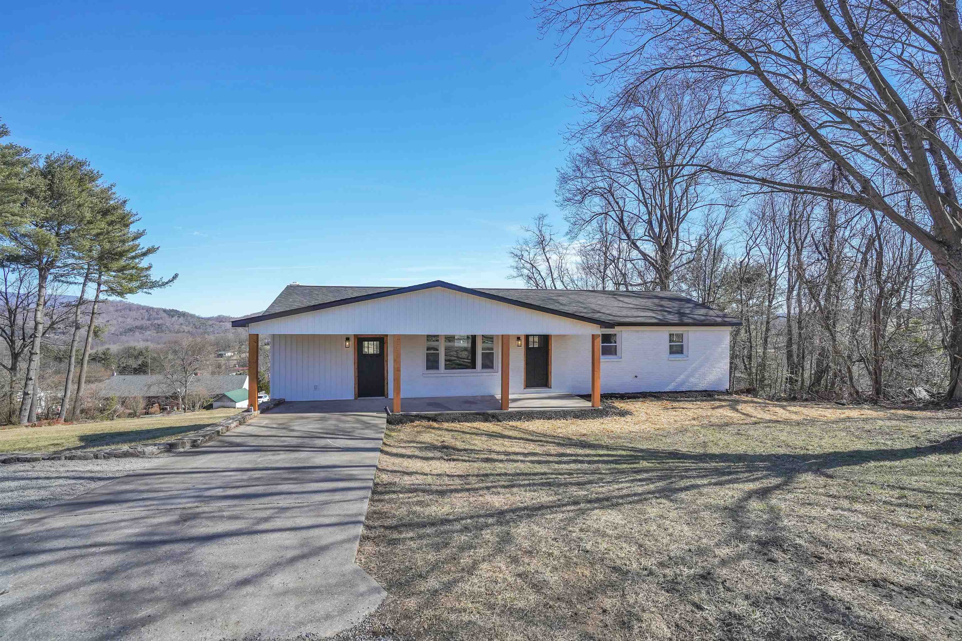 Beautifully and completely remodeled brick ranch on a dead-end street just out of town limits. A mile from shopping, food, and hospital...only 30 minutes to Virginia Tech. This home was taken down to the studs and custom built.  An absolute hidden gem.  3 beds and 2 full baths, newly opened floor plan and a flexible bonus room that could be a large dining room or family den.   The basement is ready to be finished to meet your needs or provides ample storage.   New roof, electrical, HVAC, floors, bathrooms, kitchen, appliances, windows, doors, and walls.  Newly finished laundry room with main floor laundry chute added for convenience.  Granite countertops and attention to detail throughout.   A must see - call today to schedule your showing.