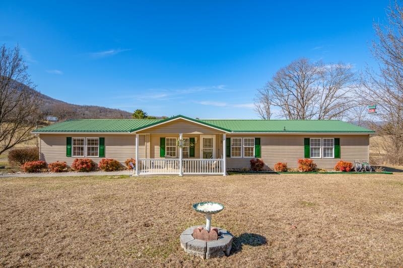 Immaculate Doublewide on 1.78 acres just outside town limits of Pearisburg. Move-in Ready! Great Kitchen w/2 pantries, island and appliances. Formal Dining RM. Large Living RM w/fireplace/gas logs. Huge Master Bedroom w/walk-in closet & adjoining Bath and adjoining office. Other 2 BDRMS both have 2 walk-in closets each! Laundry on main level w/washer/dryer. Relax on the covered front porch w/tile floor. Garden space w/fencing. Detached Double Garage w/paved drive. Huge Storage building & more!