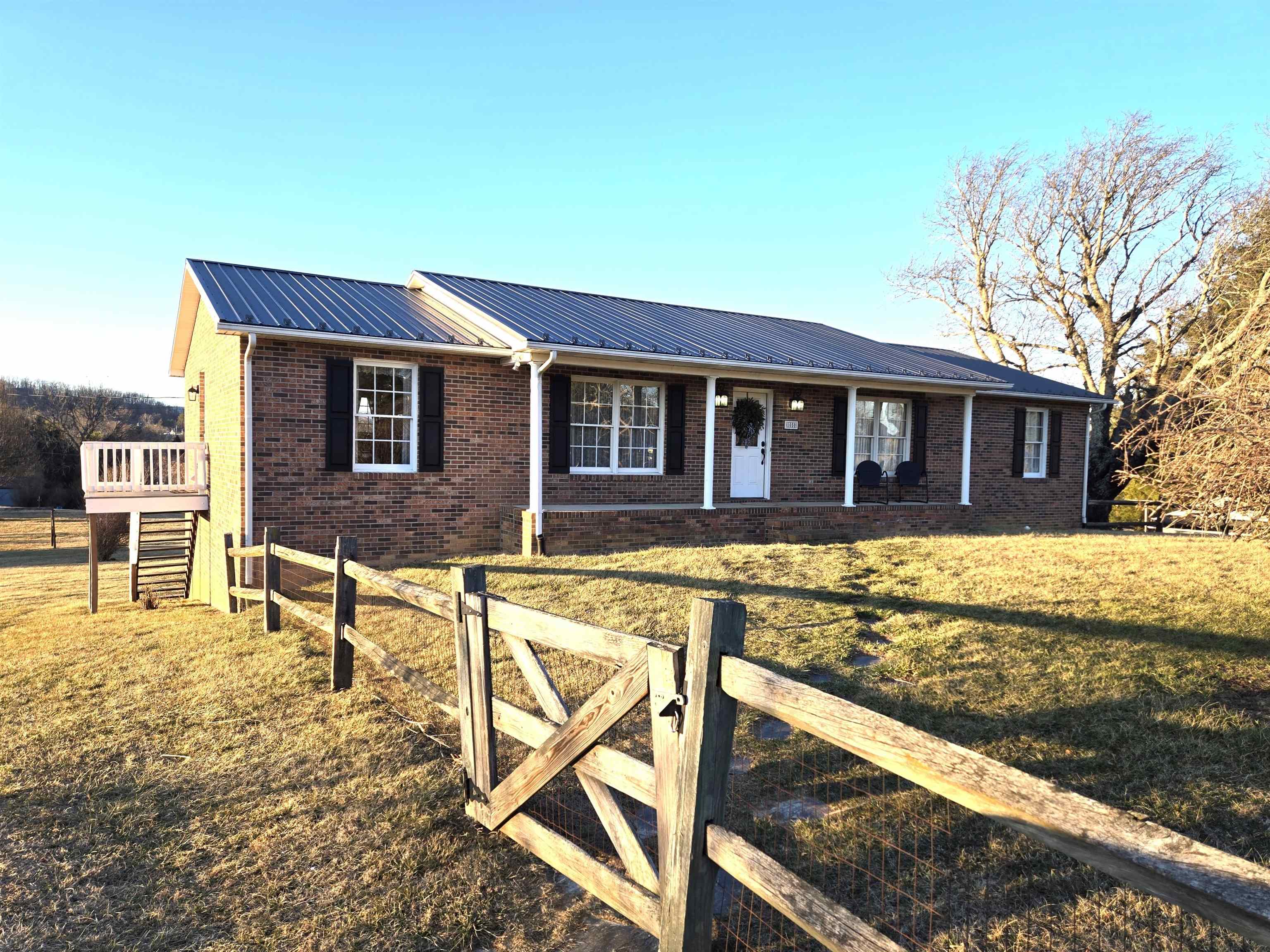 One level living at it's best this well maintained 3BR 2 and 1/2 Bath ranch offers large rooms, oak floors, new metal roof and heat pump.  Full unfinished basement could easily be finished for additional living space.  Property offers fenced in front yard, large back yard and great views.