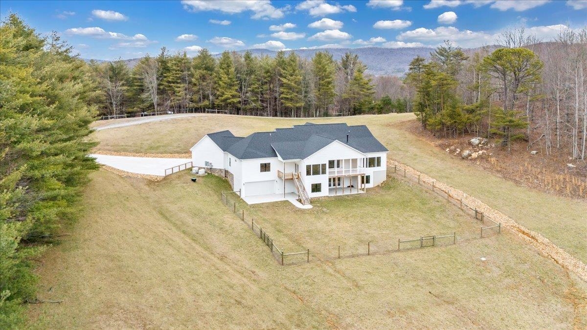 Nestled on a serene 31-acres, this stunning home, built in 2023, combines luxury with peaceful countryside living. The open floor plan features 4 spacious bedrooms, 3 full bathrooms, an office,2 half bathrooms, and an open rec room in the basement perfect for a gym or kids playroom. The kitchen boasts sleek granite countertops, high-end appliances, and ample cabinet space, flowing seamlessly into the living and dining areas—ideal for entertaining. Large windows throughout offer tons of natural light & beautiful views. The private master suite provides a luxurious en-suite bathroom, a soaking tub, a walk-in shower, and an enormous master closet. Two attached garages (one under) provide ample storage/parking. The home includes two whole home Generac generators. Outside, the property includes a Morton building with an apartment perfect for guests. The expansive land has a pond & is ideal for horse lovers or those looking to start a mini farm! Don't let this beautiful property slip away!